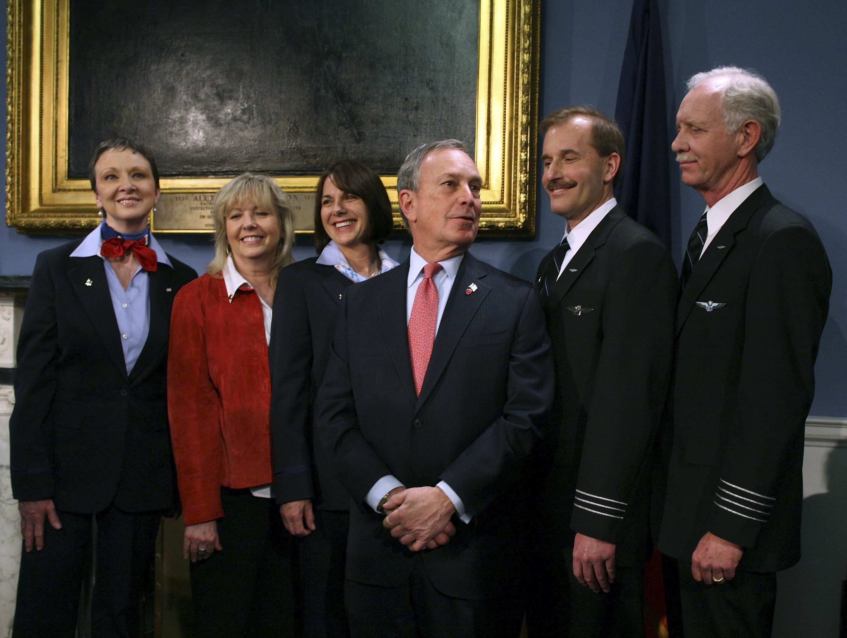 New York Mayor Bloomberg poses with the crew of US Airways Flight 1549 after receiving their 'Keys to the City' at City Hall