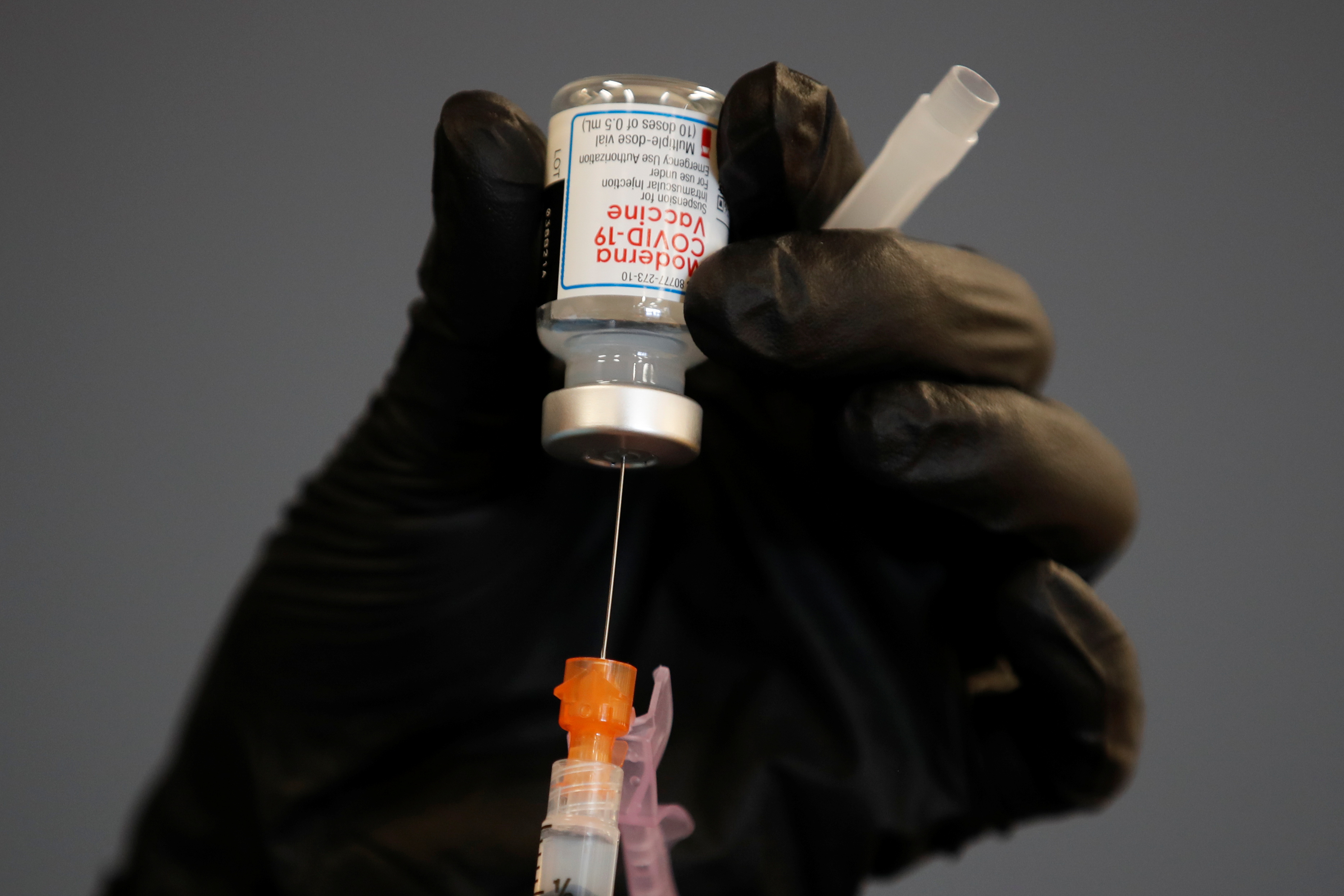 A health care worker fills a syringe with Moderna COVID-19 vaccine as California opens up vaccine eligibility to any residents 16 years and older during the outbreak of coronavirus disease (COVID-19) in Chula Vista, California, U.S., April 15, 2021. REUTERS/Mike Blake