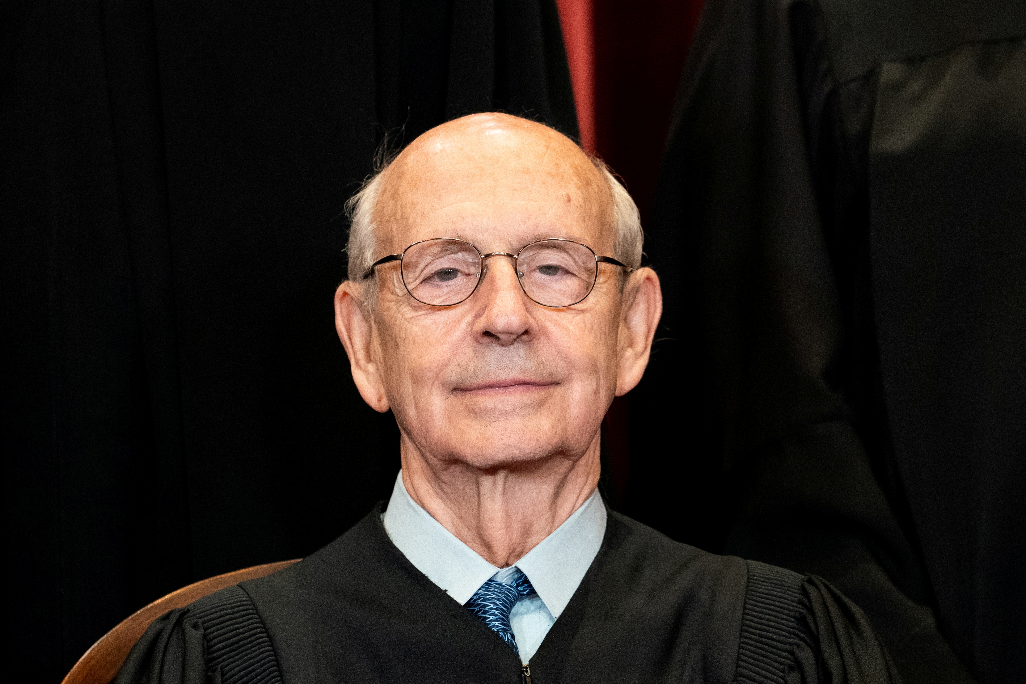 Associate Justice Stephen Breyer poses during a group photo of the Justices at the Supreme Court in Washington