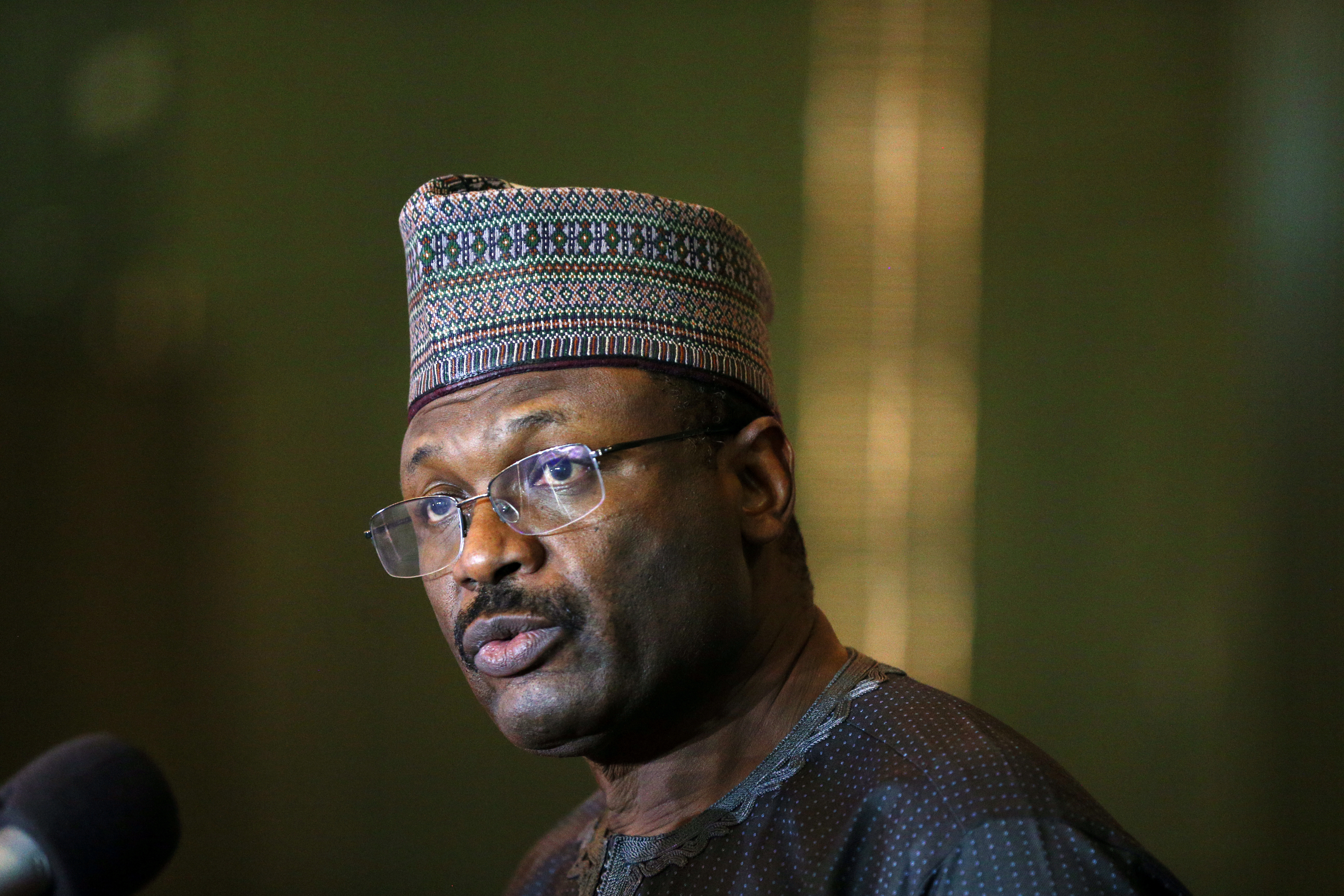 Mahmood Yakubu, Chairman of the Independent National Electoral Commission (INEC) addresses the media after the postponement of Nigeria's presidential election in Abuja