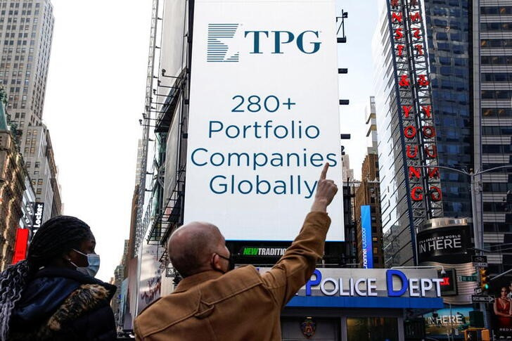 A screen announces the listing of Private-equity firm TPG, during the IPO at the Nasdaq Market site in Times Square in New York