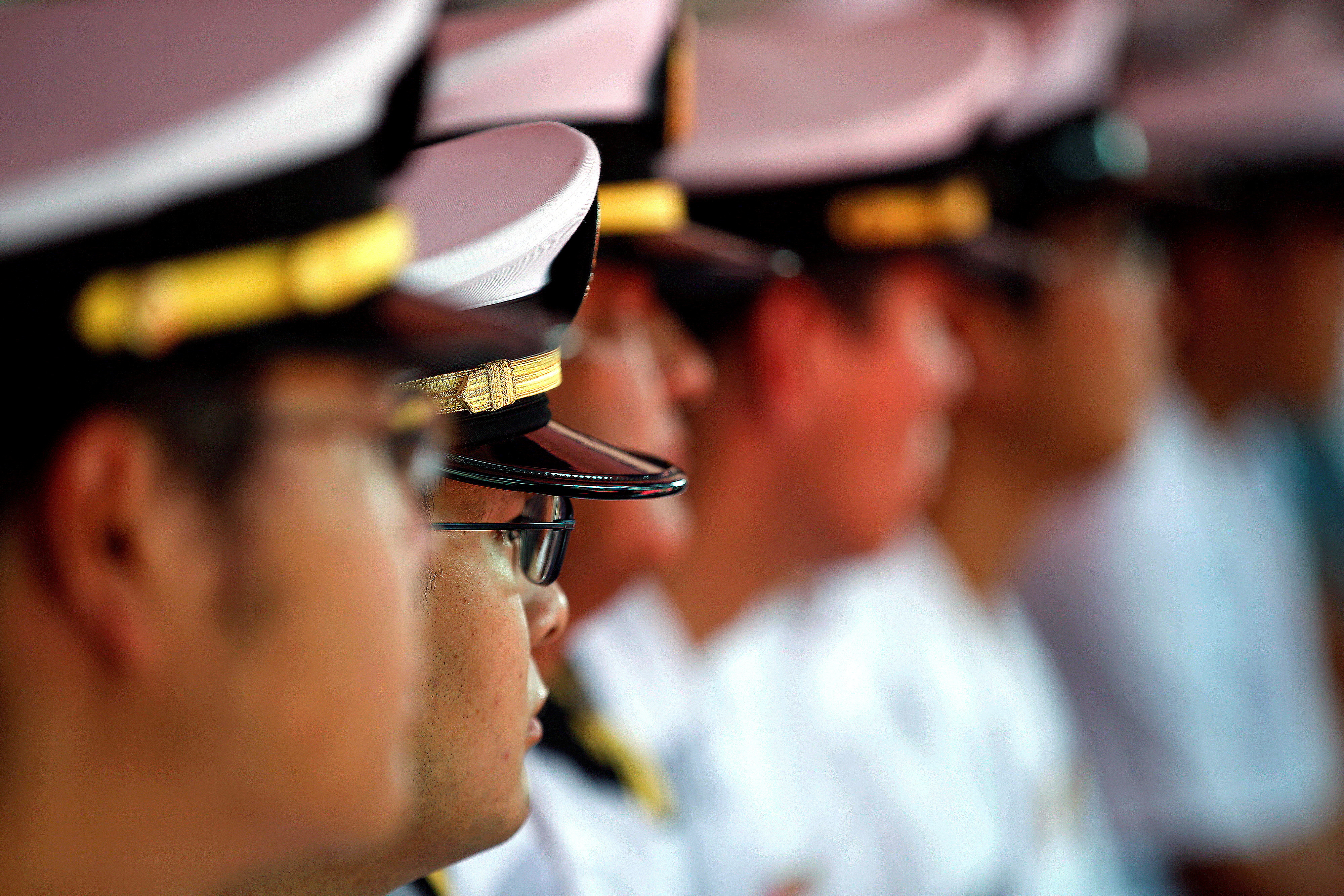 FILE PHOTO: Japan's Maritime Self-Defence Forces listen to a speech during a visit of Japanese warship JS Samidare at Jakarta International Container Terminal at Tanjung Priok port in Jakarta