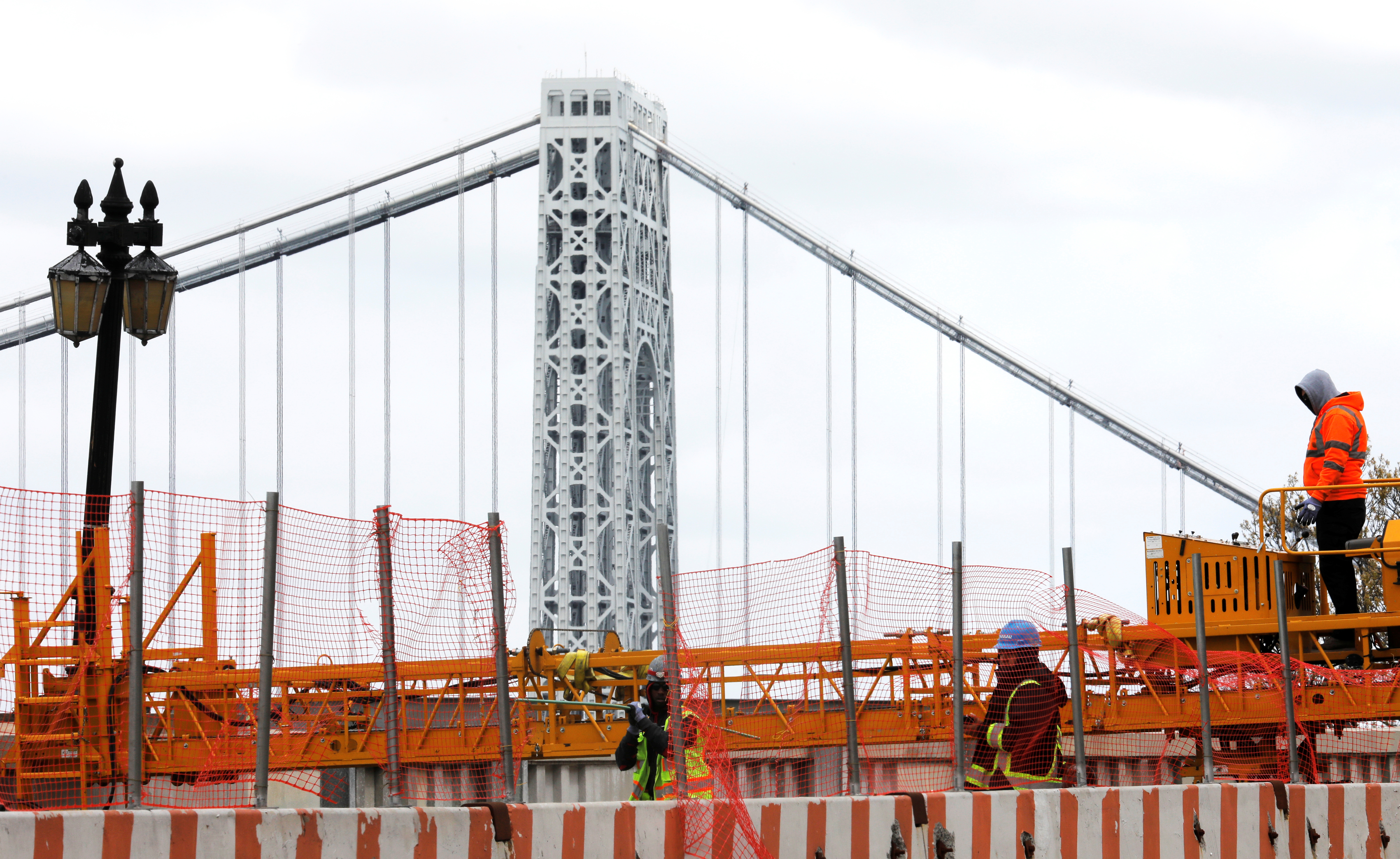 Construction workers are seen at the site of a large public infrastructure reconstruction project in New York