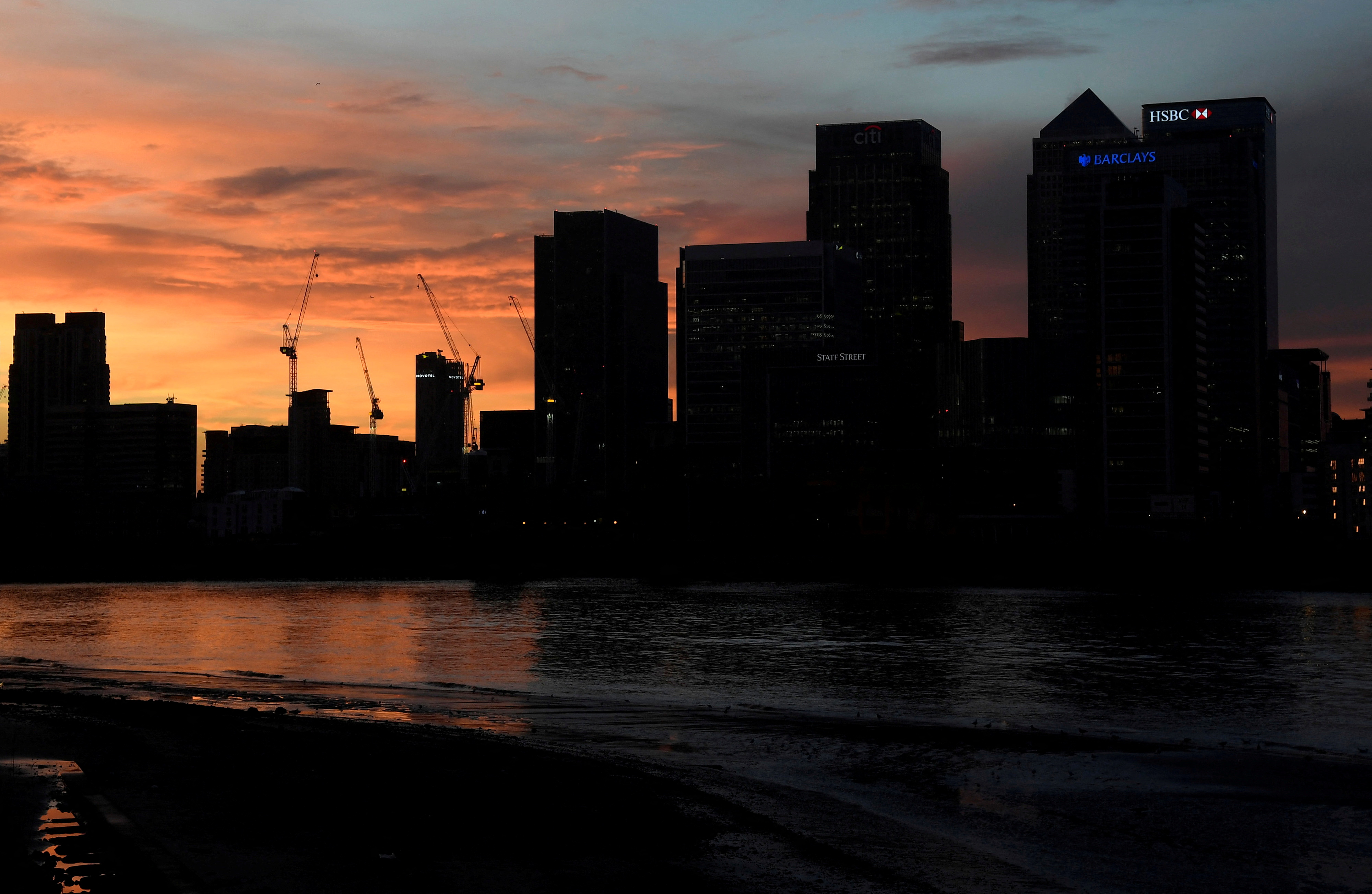 The Canary Wharf business district is seen at dusk in London