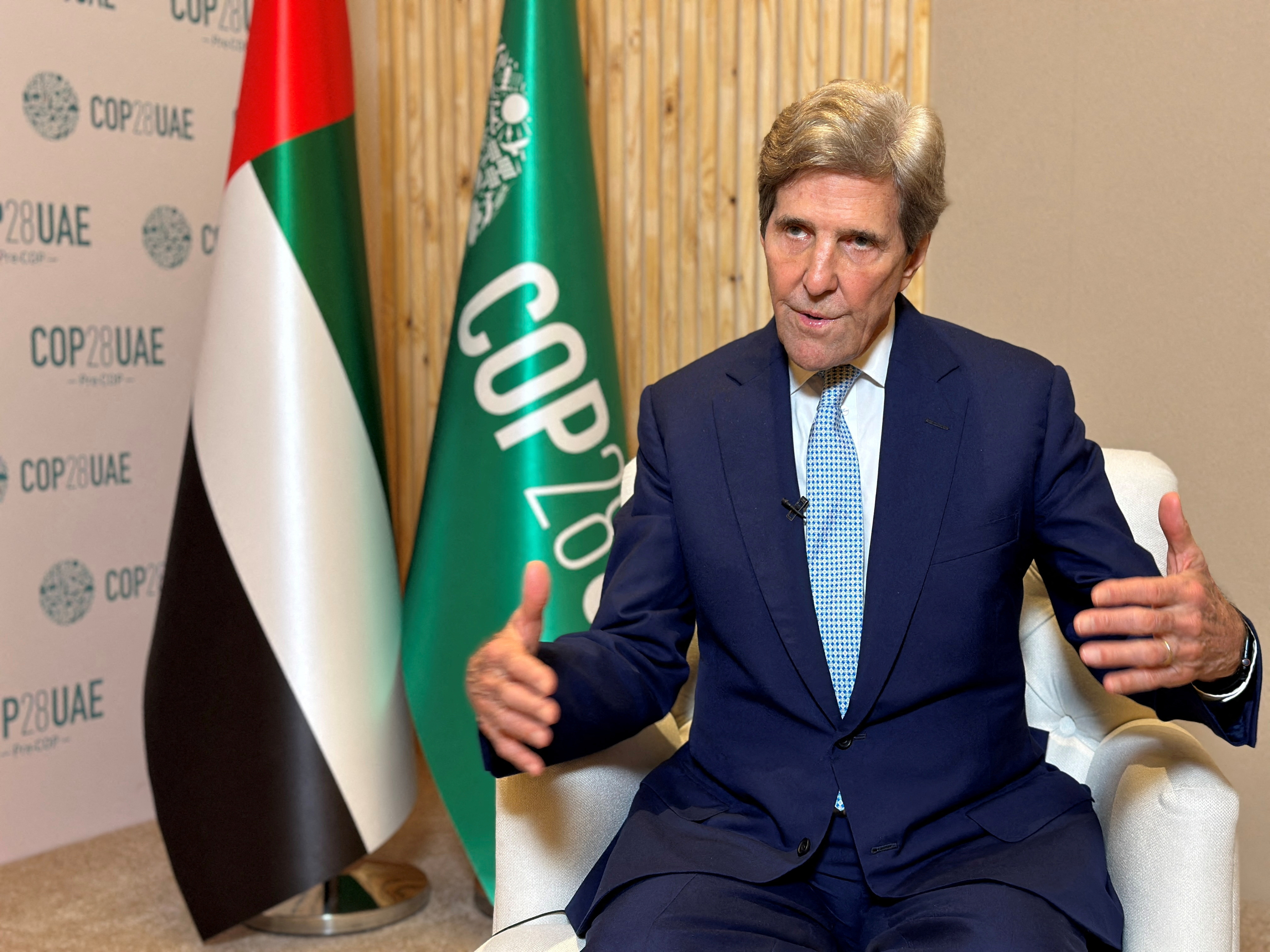 John Kerry, U.S. Special Presidential Envoy for Climate speaks during an earlier interview with Reuters, in  Abu Dhabi