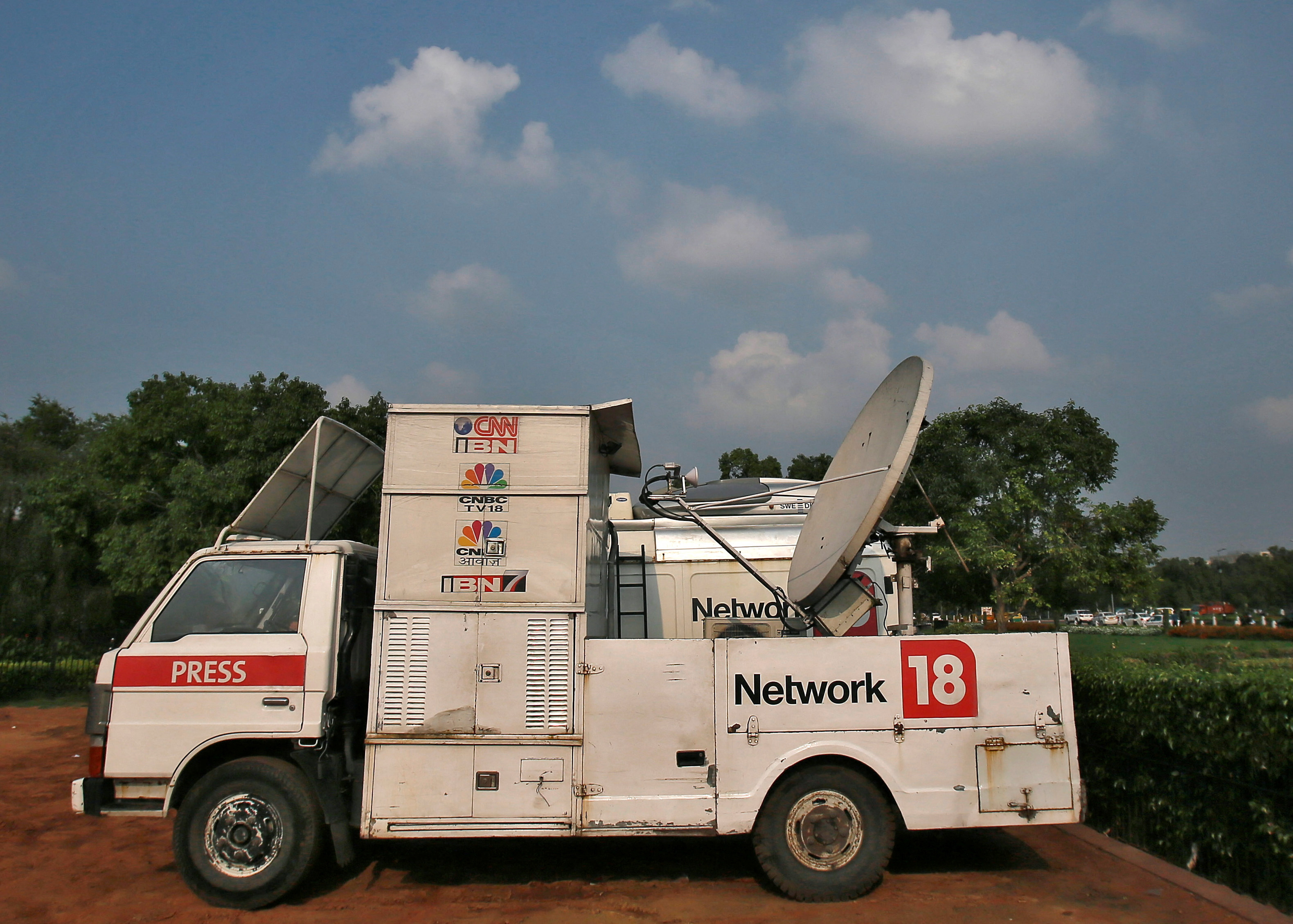 A van from the Network18 media group is parked in front of the Indian Parliament in New Delhi