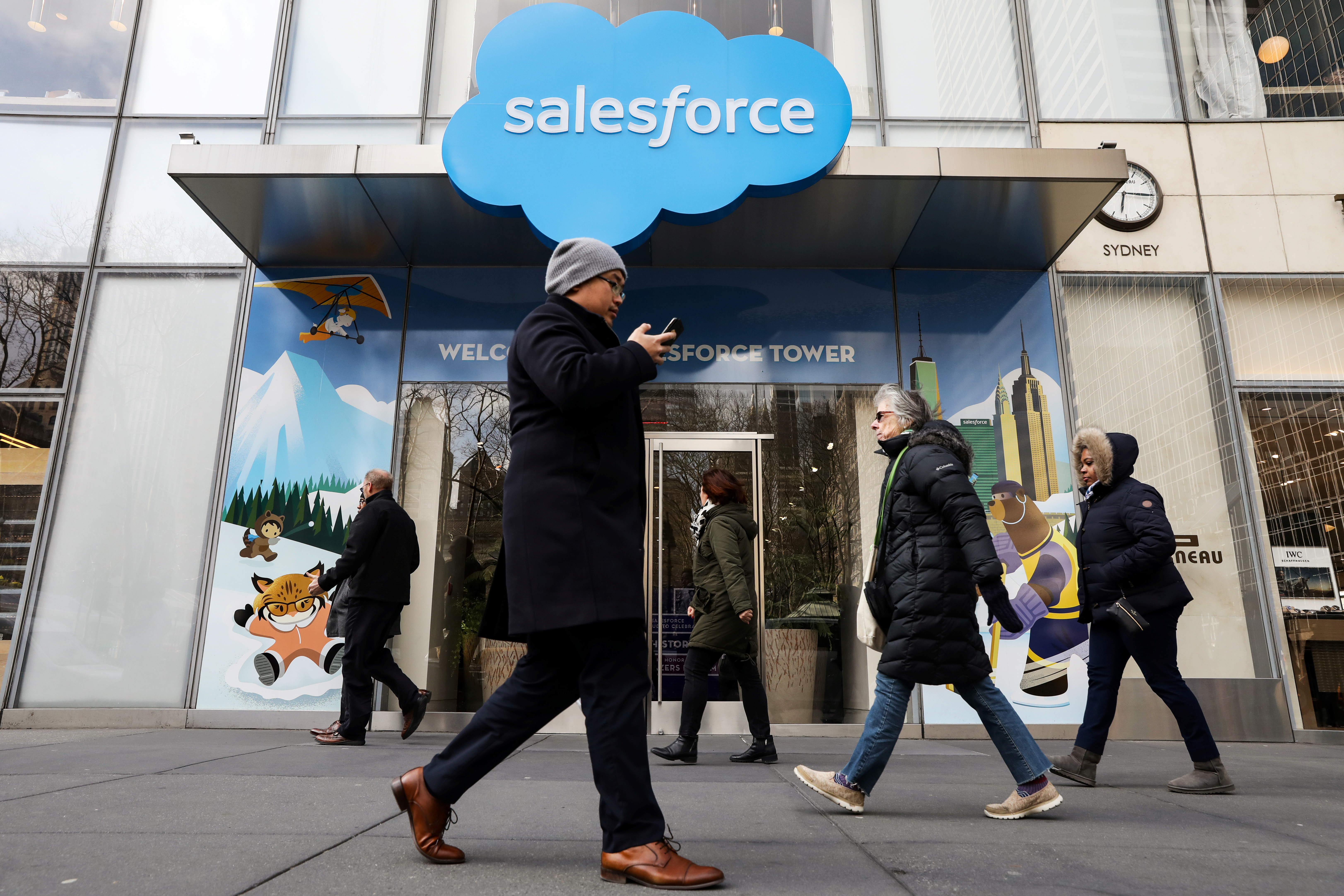 People pass by the Salesforce Tower and Salesforce.com offices in New York