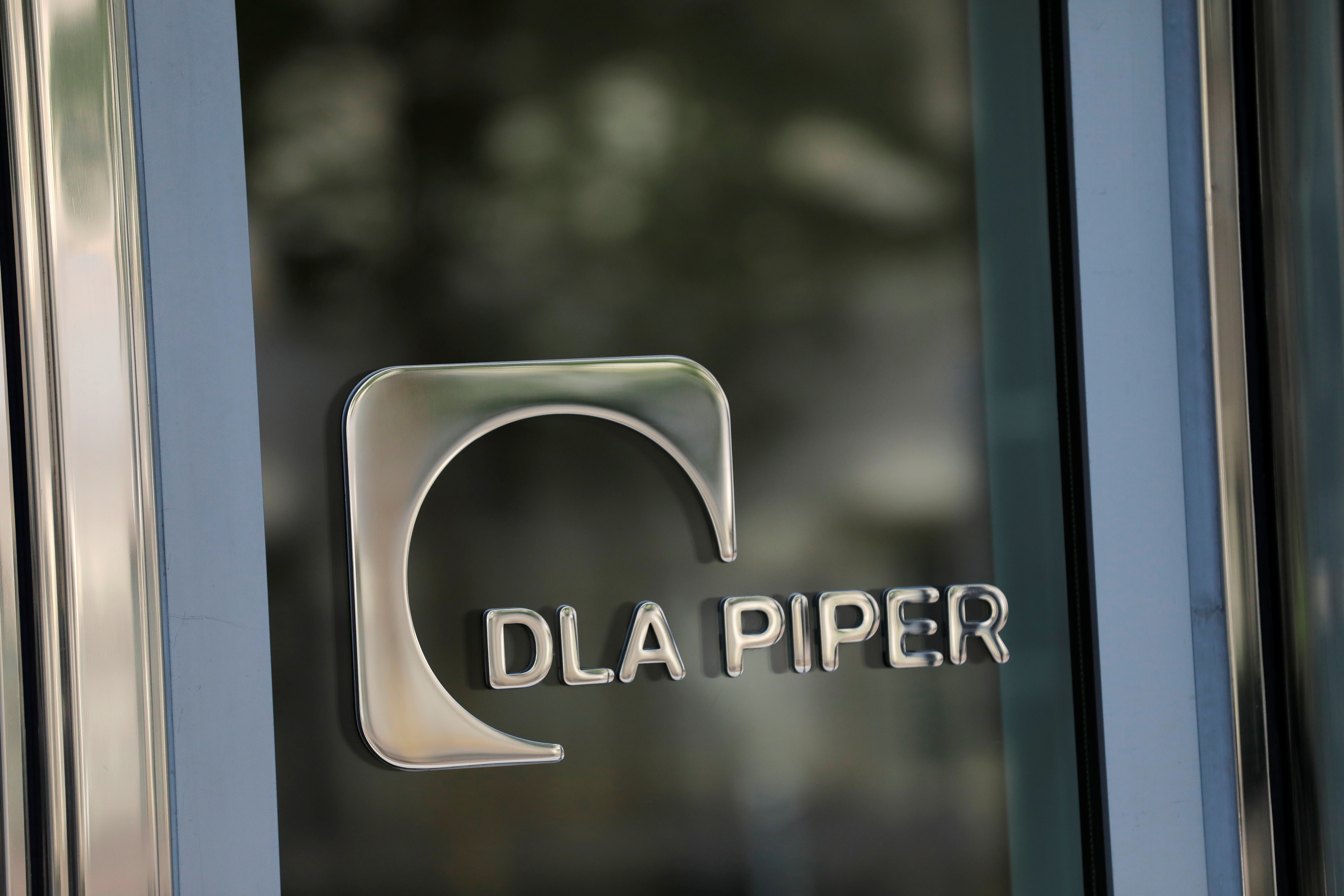 Signage is seen outside of the law firm DLA Piper in Washington, D.C., U.S., August 30, 2020. REUTERS/Andrew Kelly