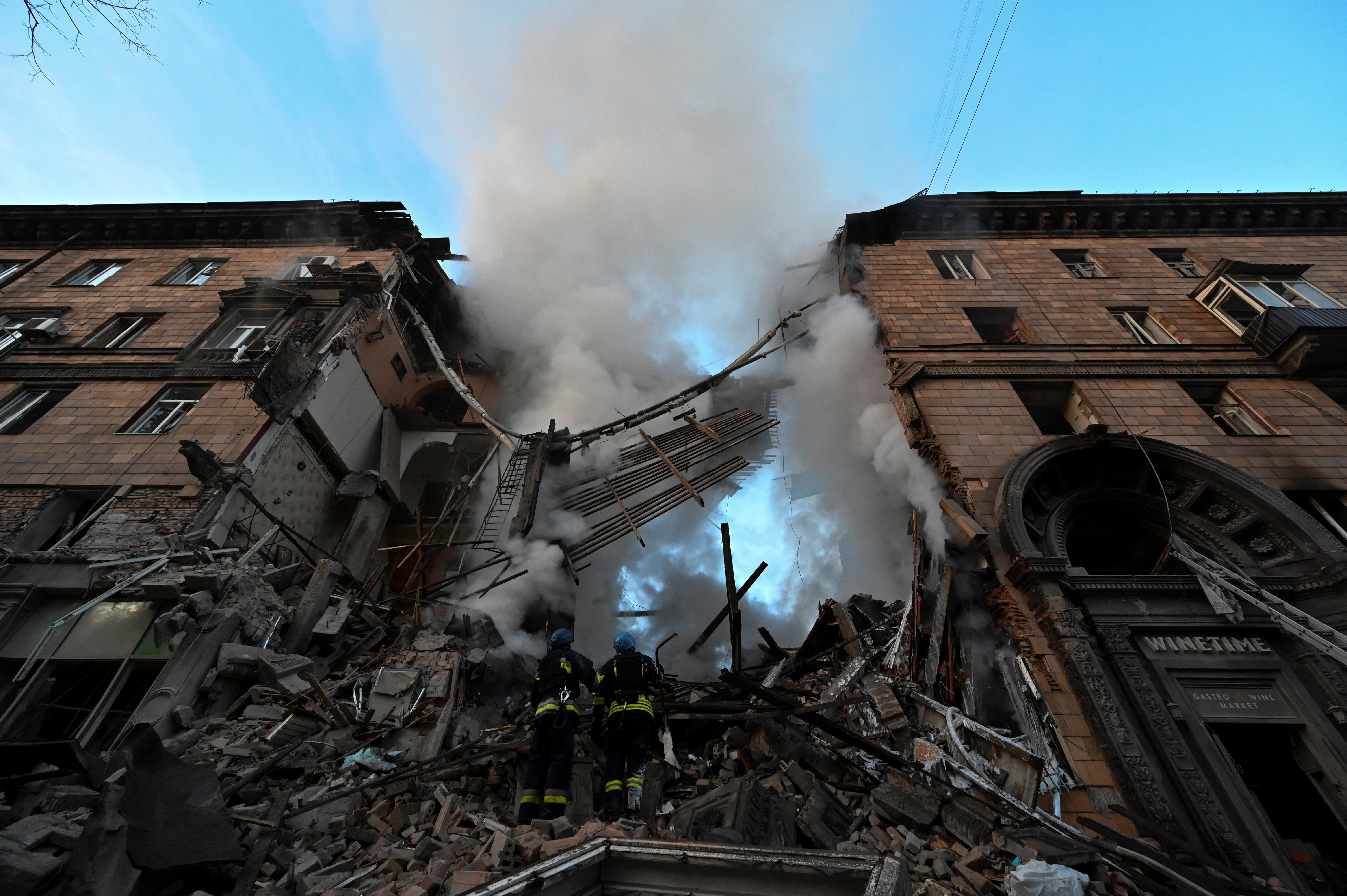 Rescuers work at a residential building which was heavily damaged by a Russian missile strike in Zaporizhzhia