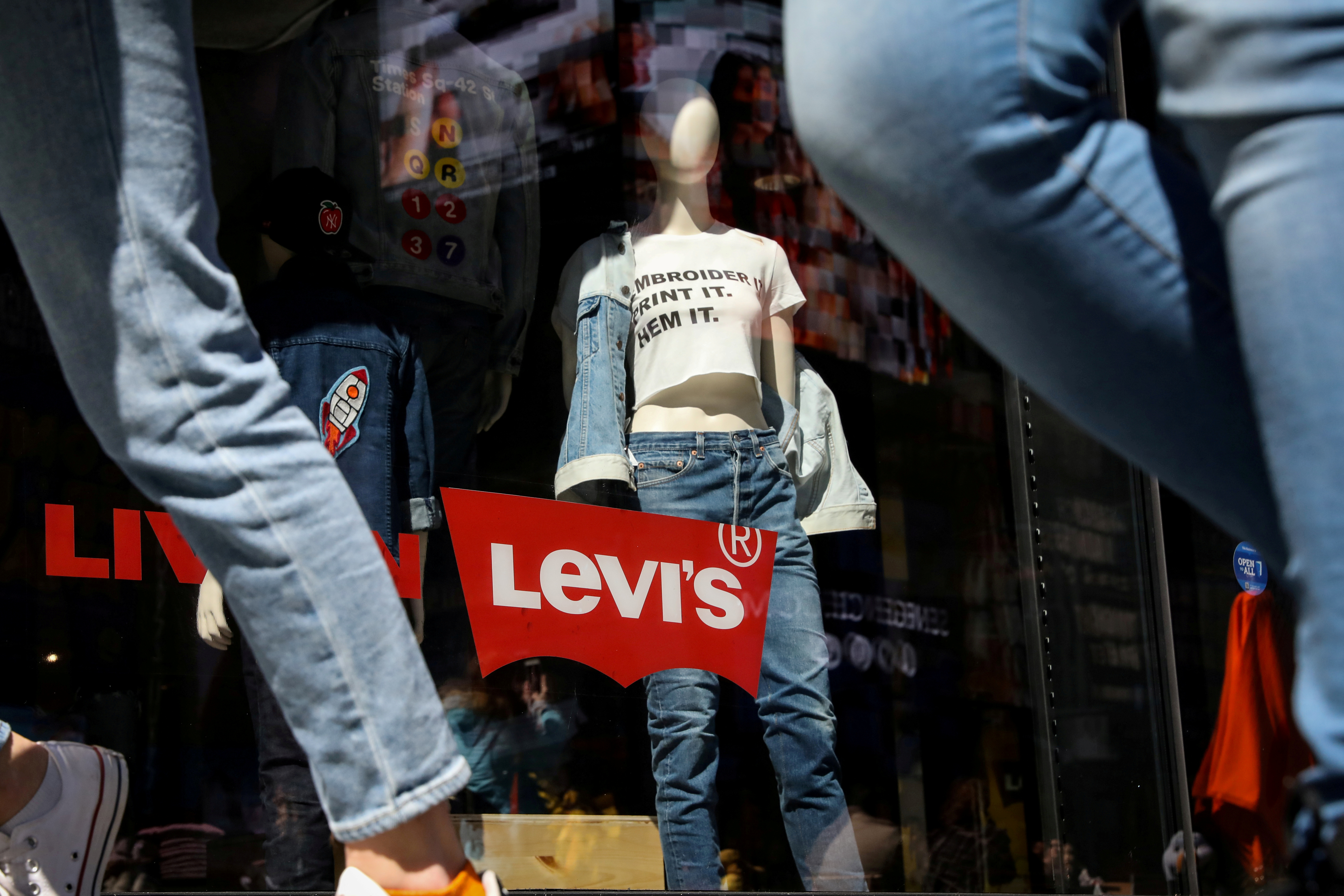 People pass by a Levi Strauss store in New York