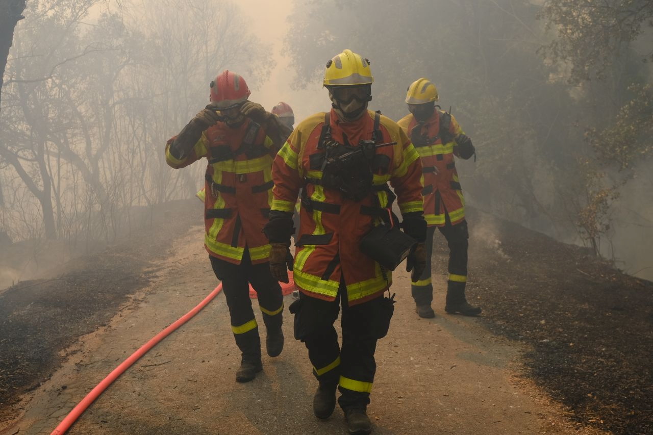 Fire fighters work to tackle a wildfire that broke out in the Var region, southern France, August 18, 2021. Securite Civile/Handout via REUTERS