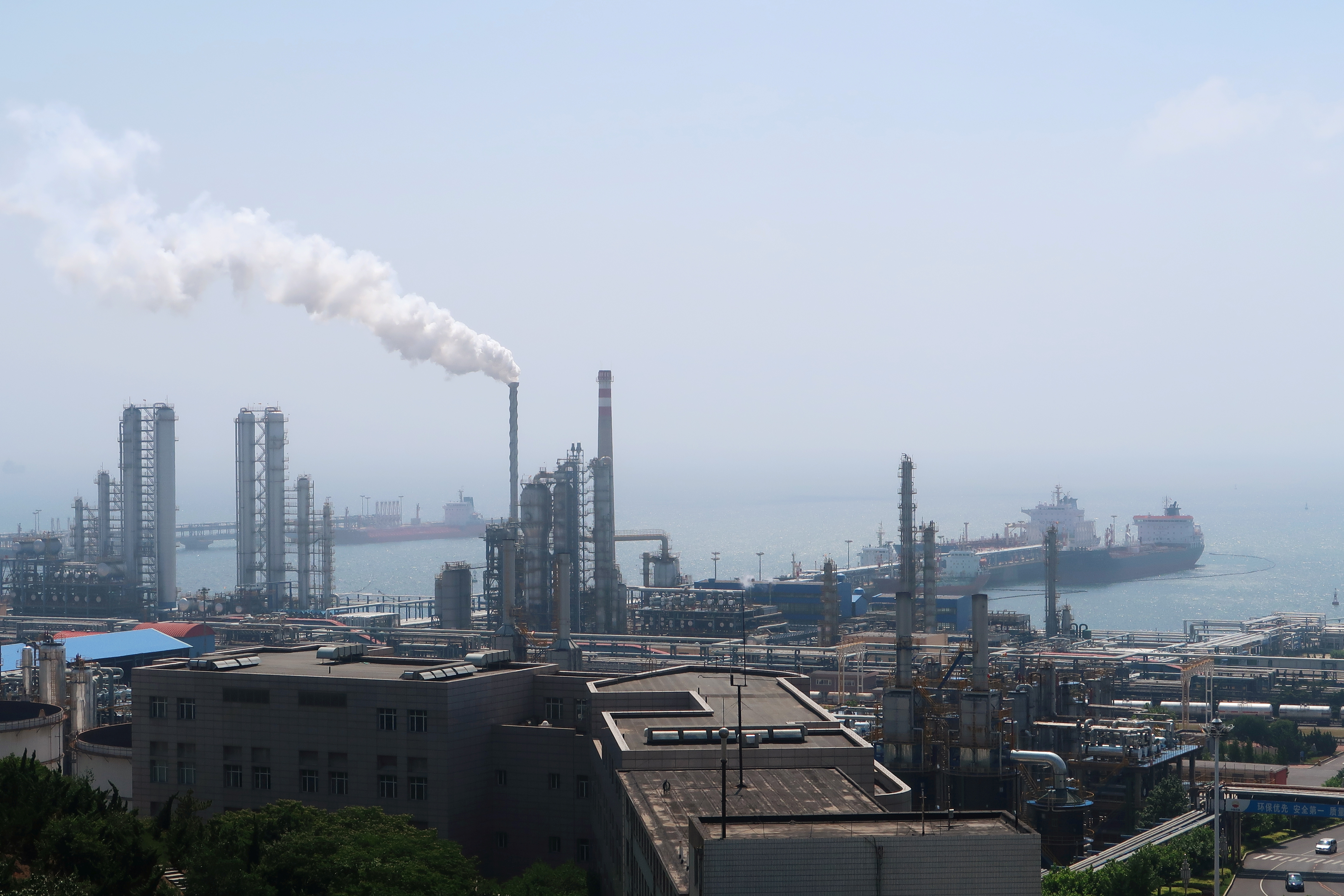 China National Petroleum Corporation (CNPC)'s Dalian Petrochemical Corp refinery is seen near the downtown of Dalian in Liaoning province, China July 17, 2018. Picture taken July 17, 2018. REUTERS/Chen Aizhu/Files