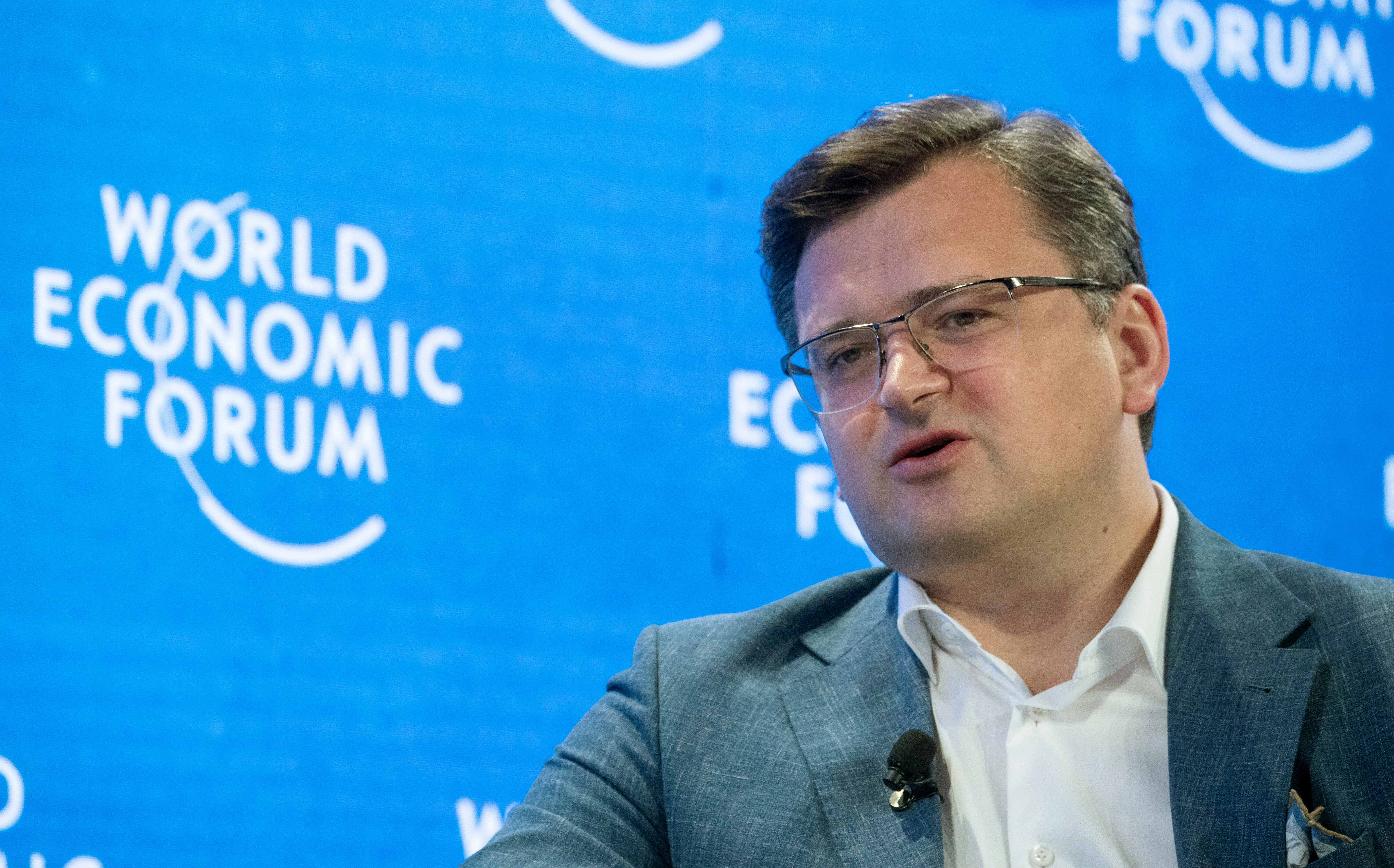 Ukrainian Foreign Minister Kuleba gestures during a discussion WEF 2022 in Davos