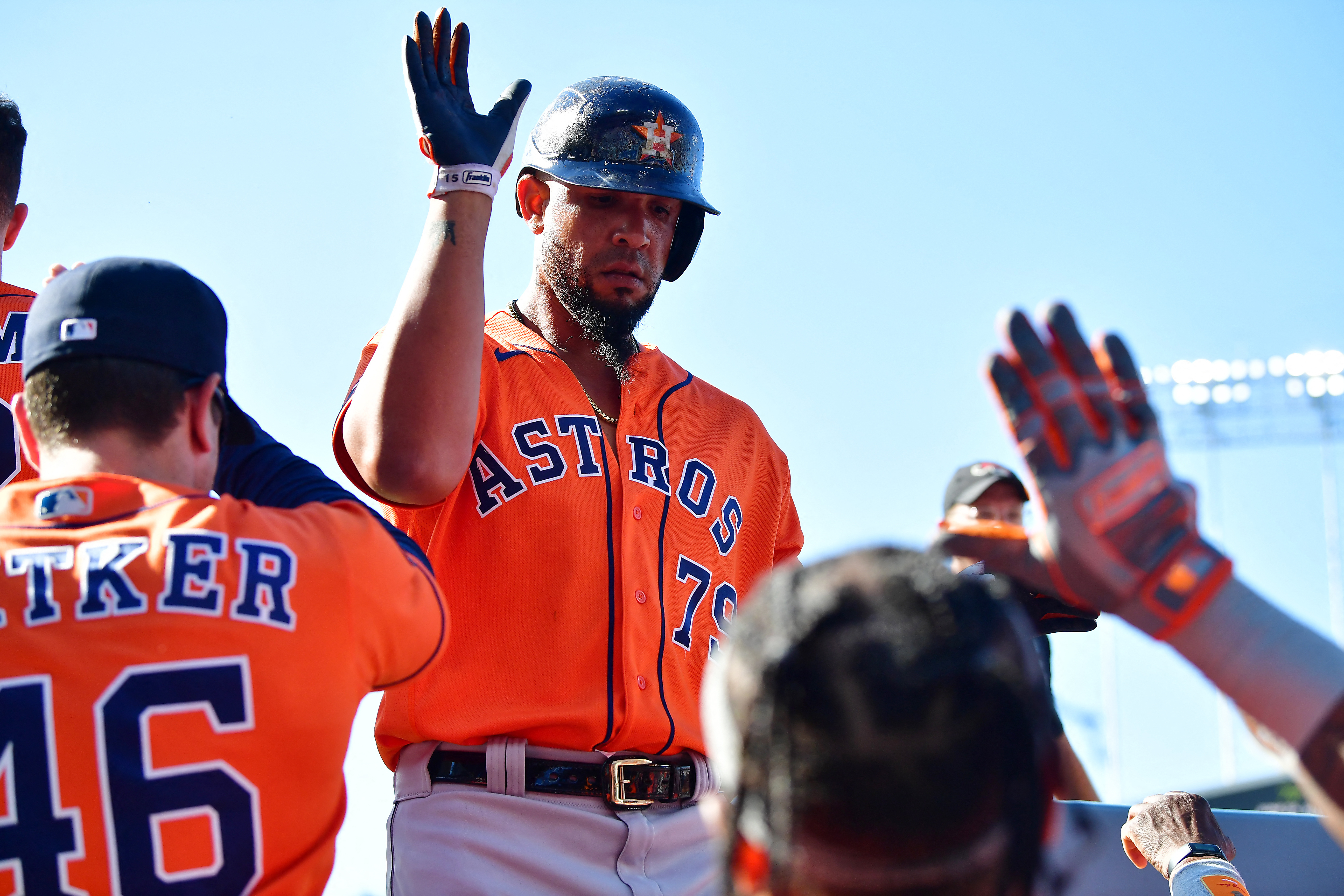 Download Alex Bregman In Orange Astros Uniform Swinging Bat Wallpaper