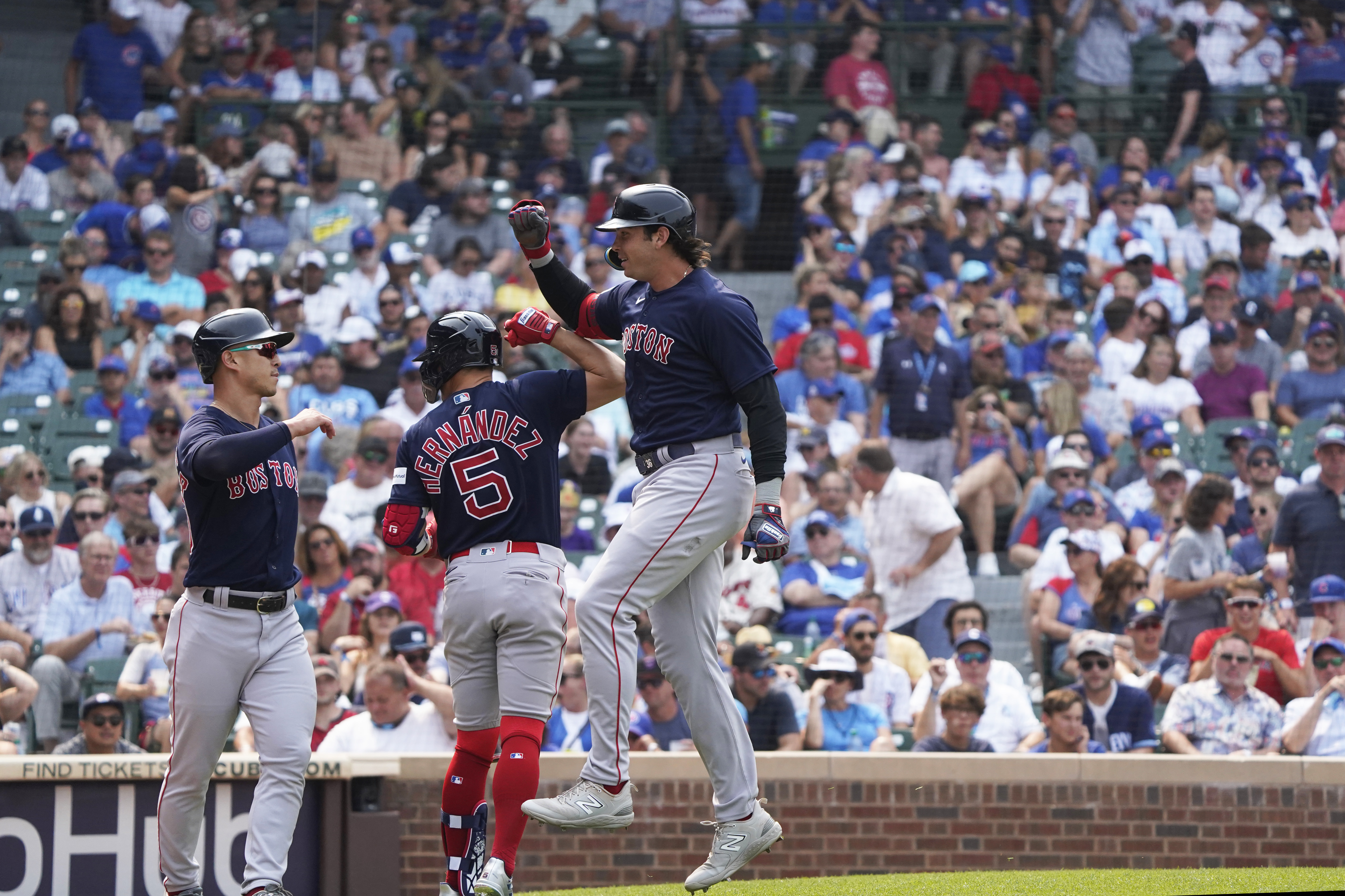 Yoshida hits a grand slam and drives in 6 as the Red Sox rout the Cubs 11-5  behind Crawford