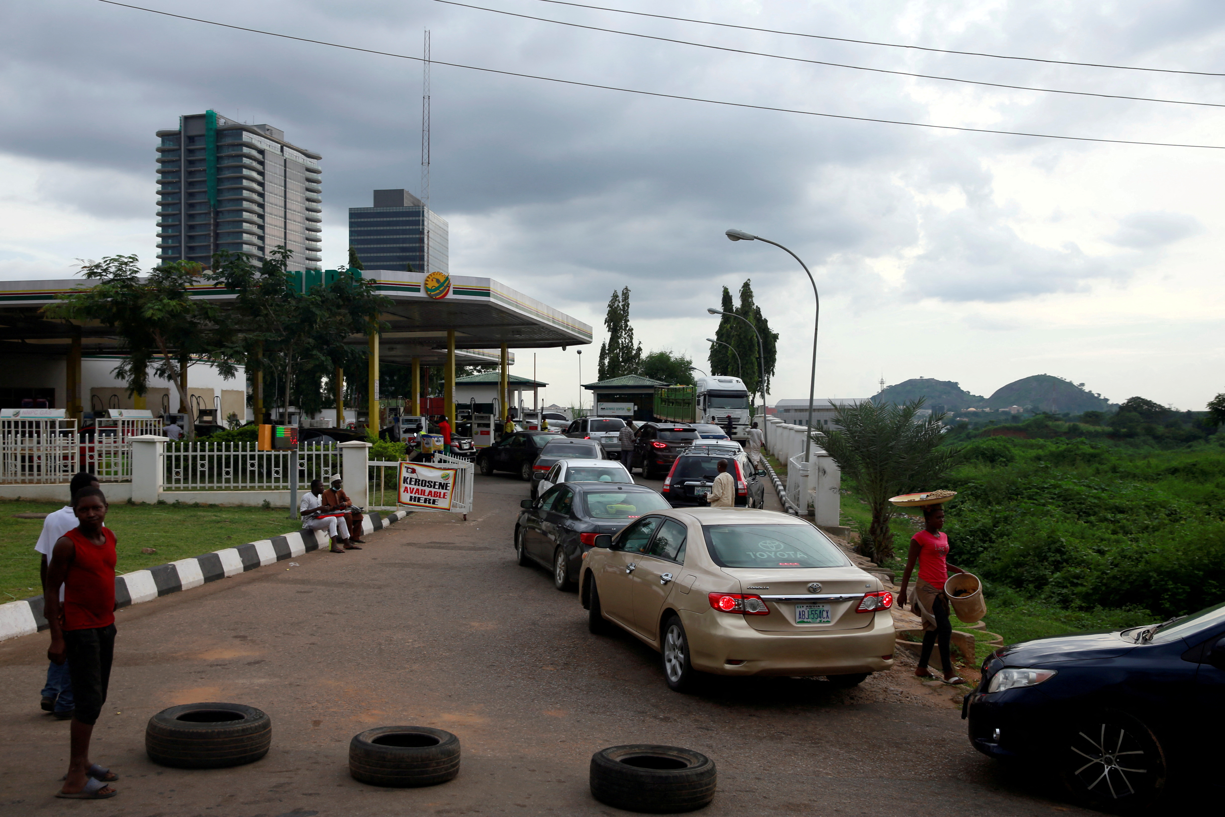 Vehicles queue for pump at NNPC retail outlet in Abuja