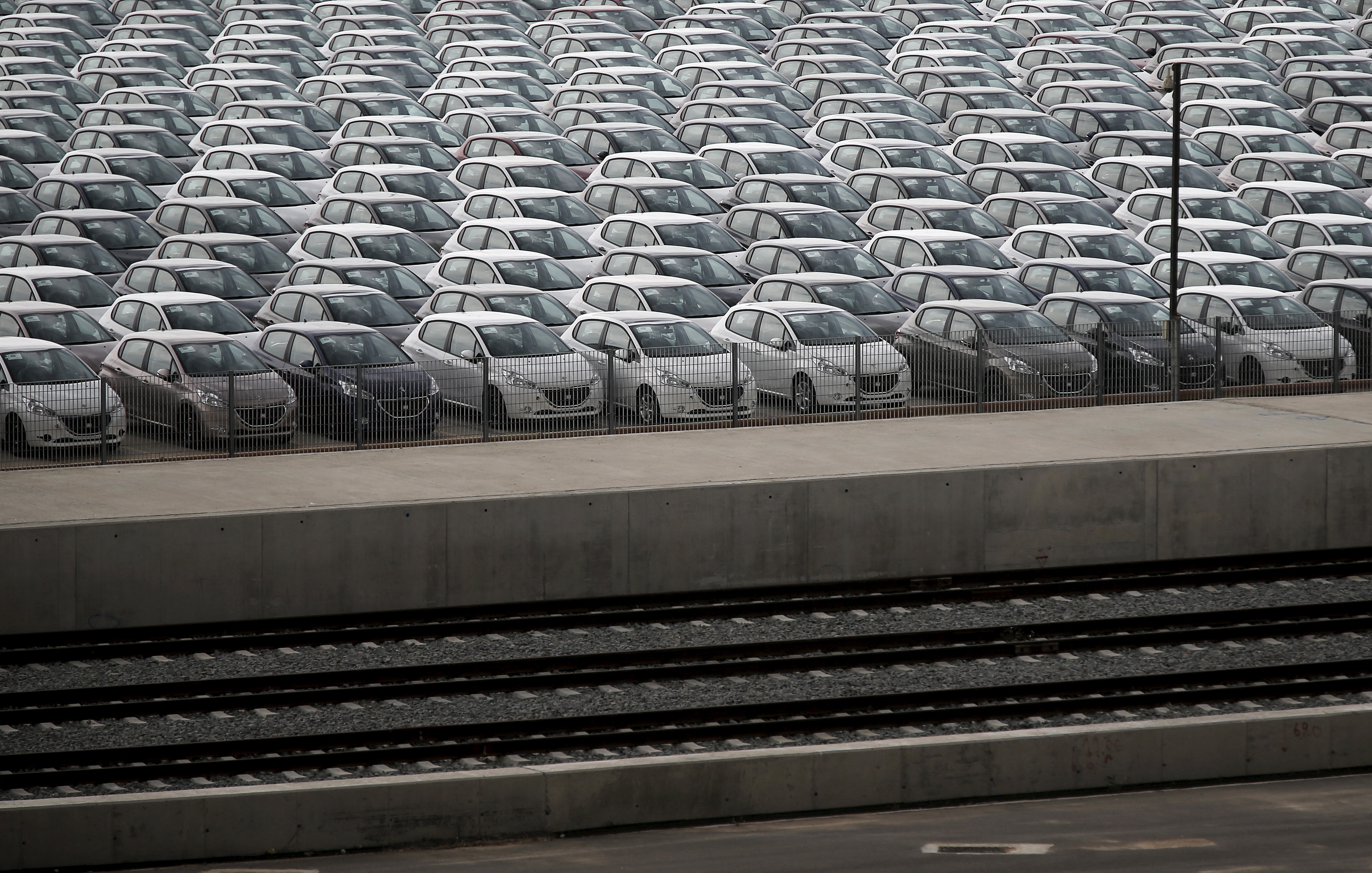 Vehicles are parked at a cargo terminal at Piraeus port, near Athens