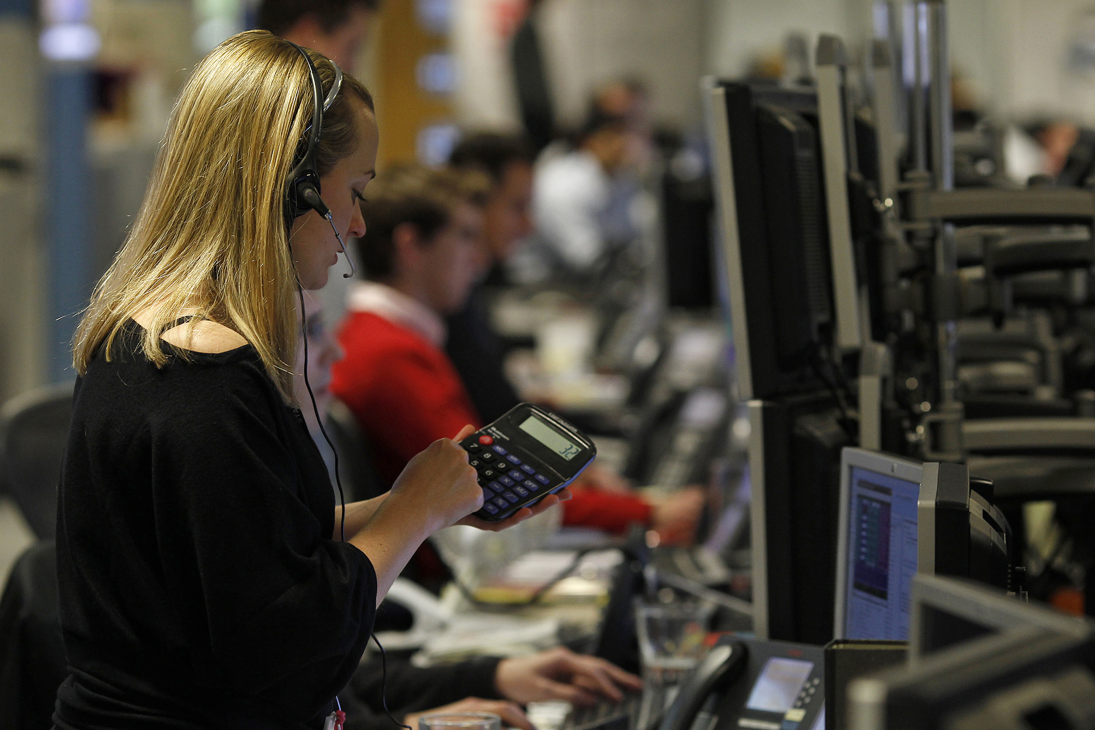 A trader works on the trading floor in London
