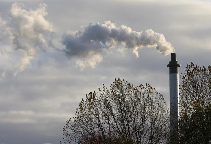 Smoke billowing from a chimney is pictured, in Glasgow