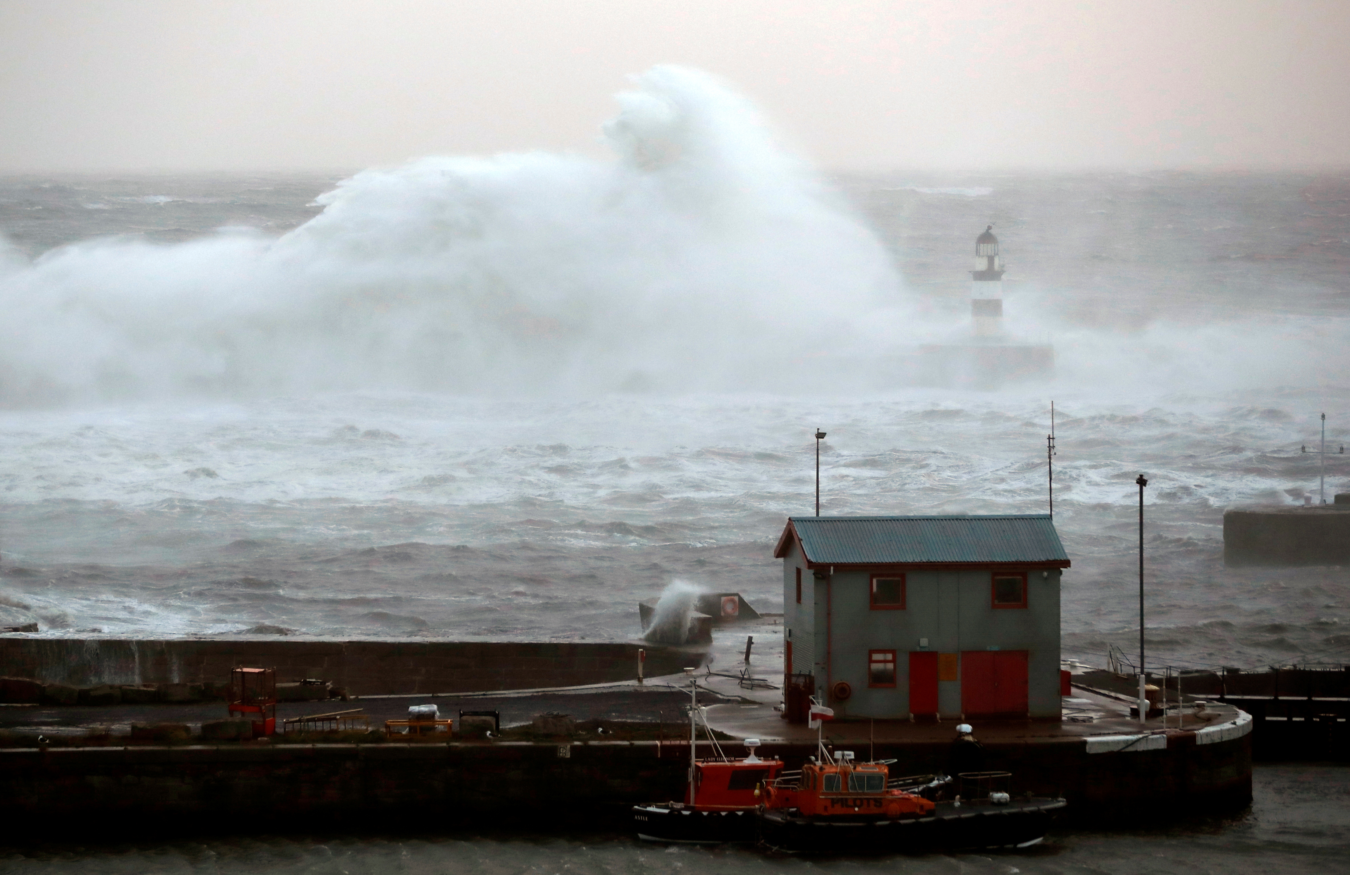 Waves crash against the pier wall at Seaham Lighthouse during Storm Arwen, in Seaham, Britain, November 27, 2021. REUTERS/Lee Smith