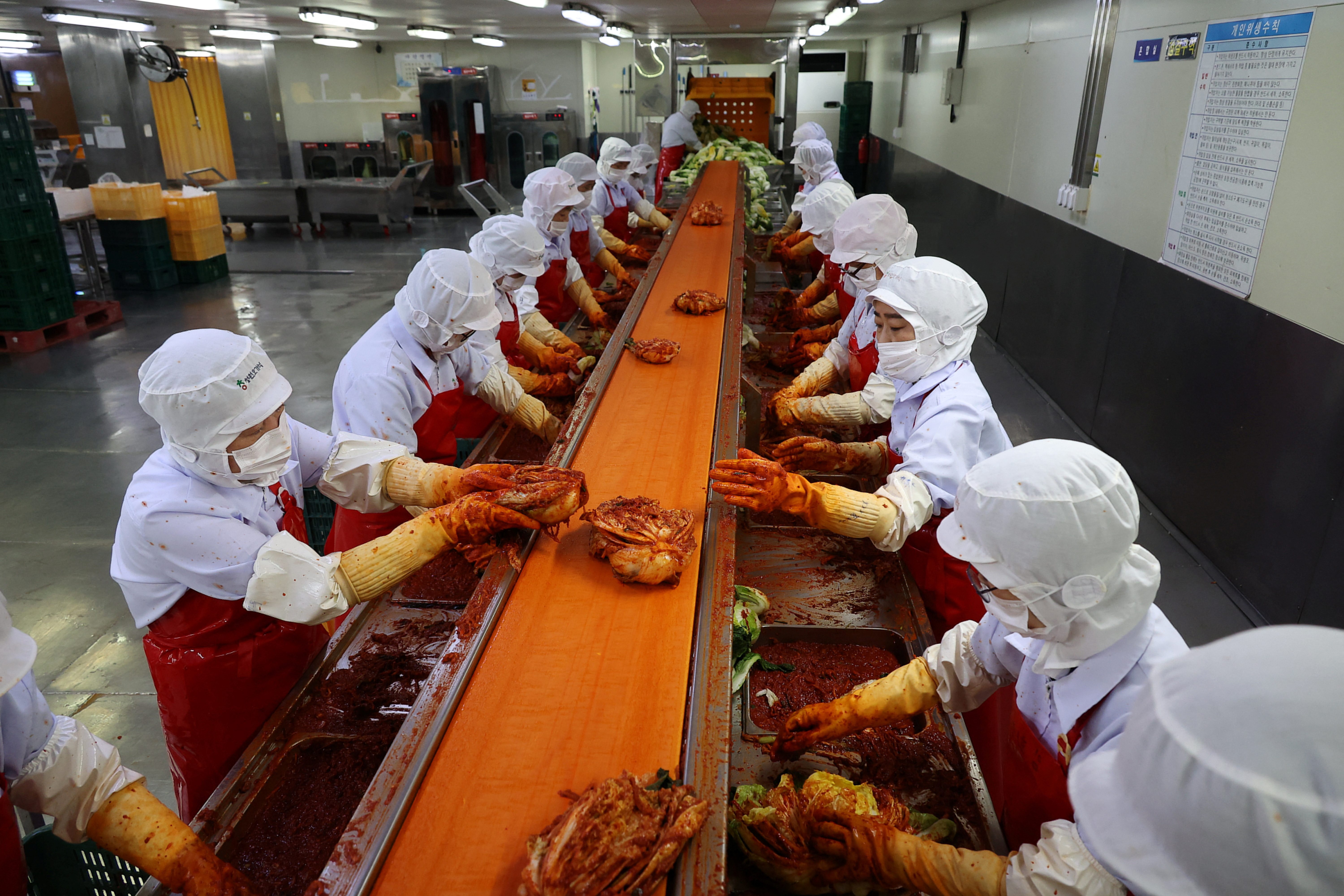 Employees work at Cheongone Organic Kimchi factory in Cheongju