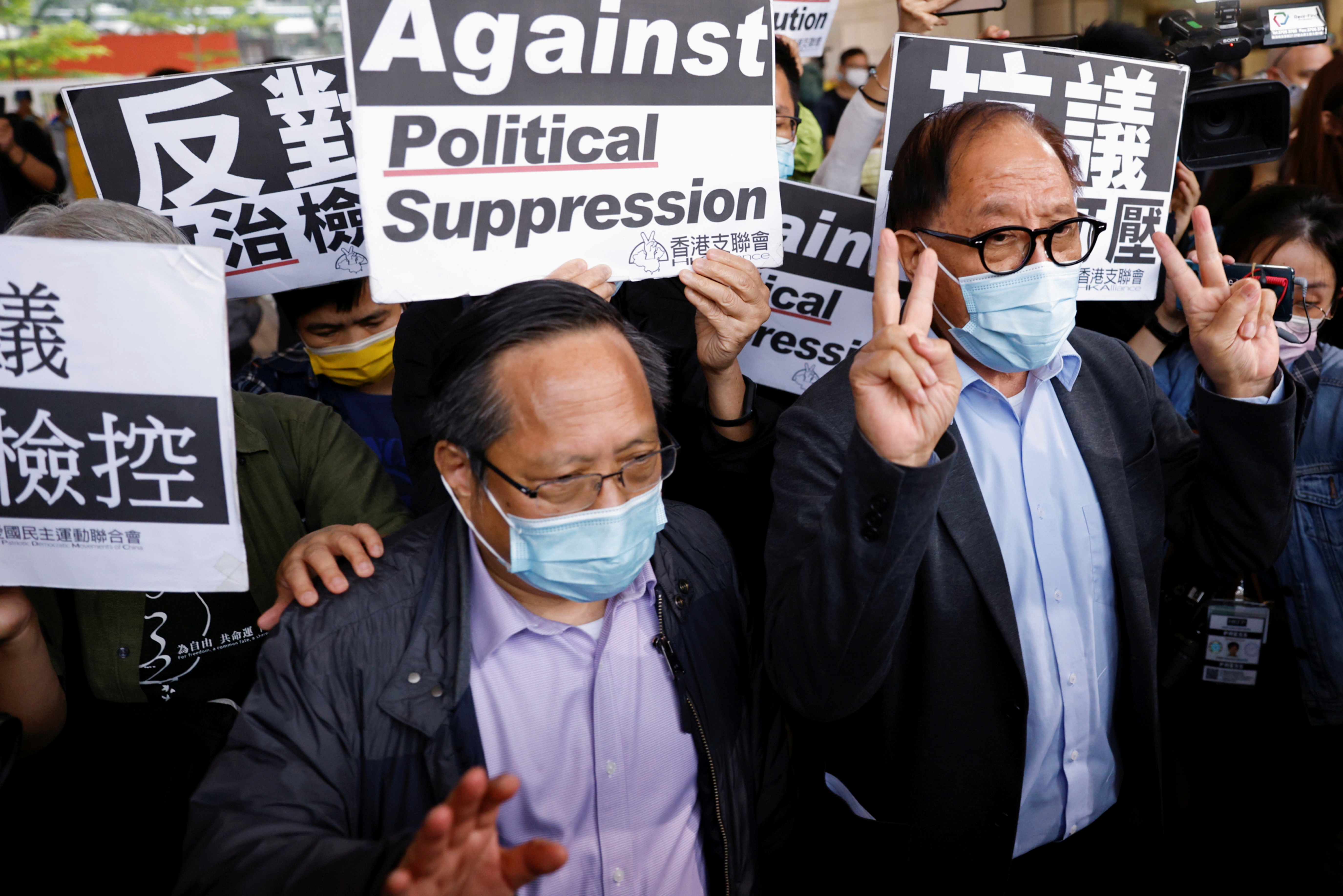 Pro-democracy activists Albert Ho and Yeung Sum leave the West Kowloon Courts after getting their suspended sentence on unauthorised assembly, in Hong Kong