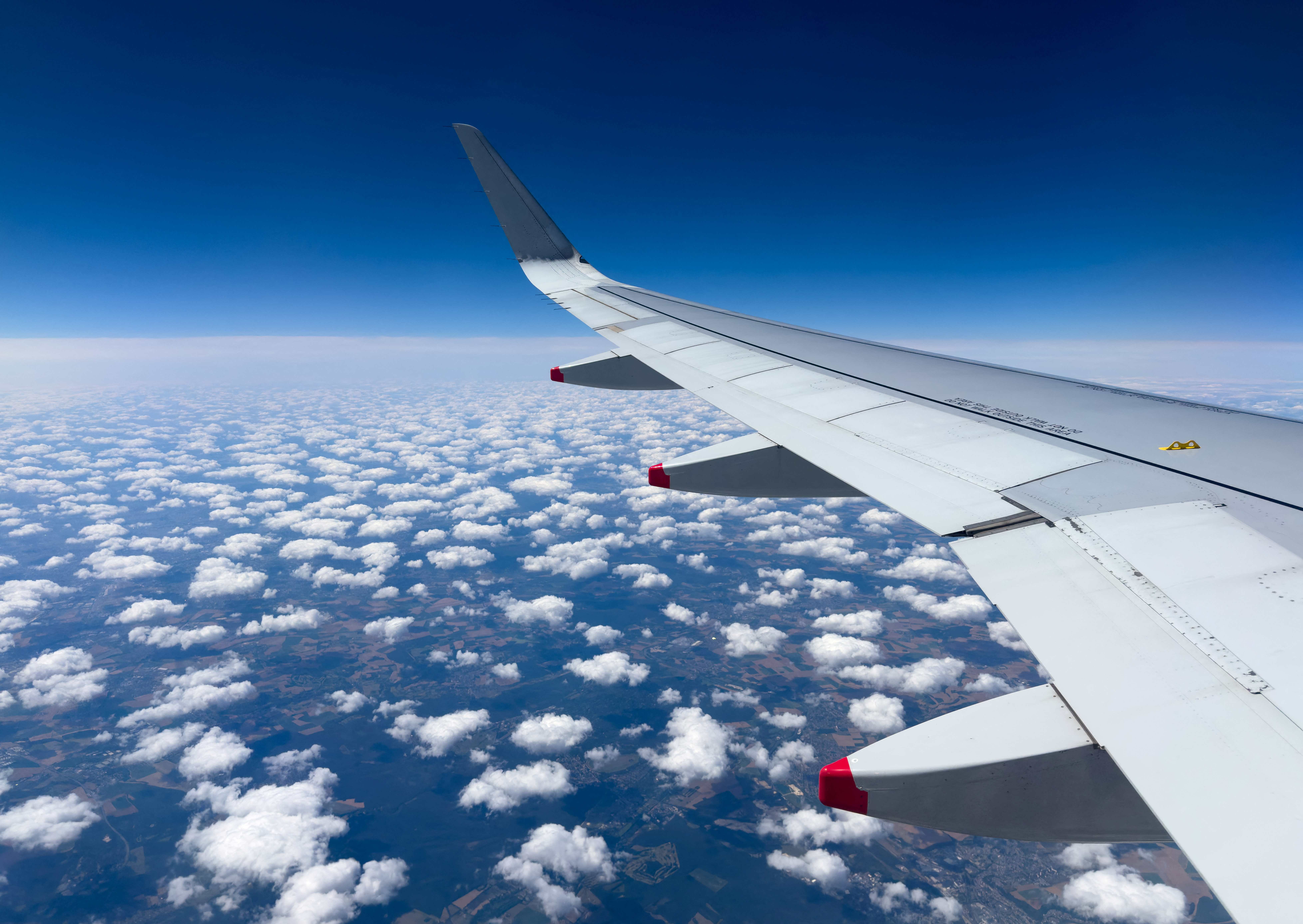 A wing of an Airbus A-320 aircraft of British Airways is pictured above northern France during a Geneva to London Heathrow flight