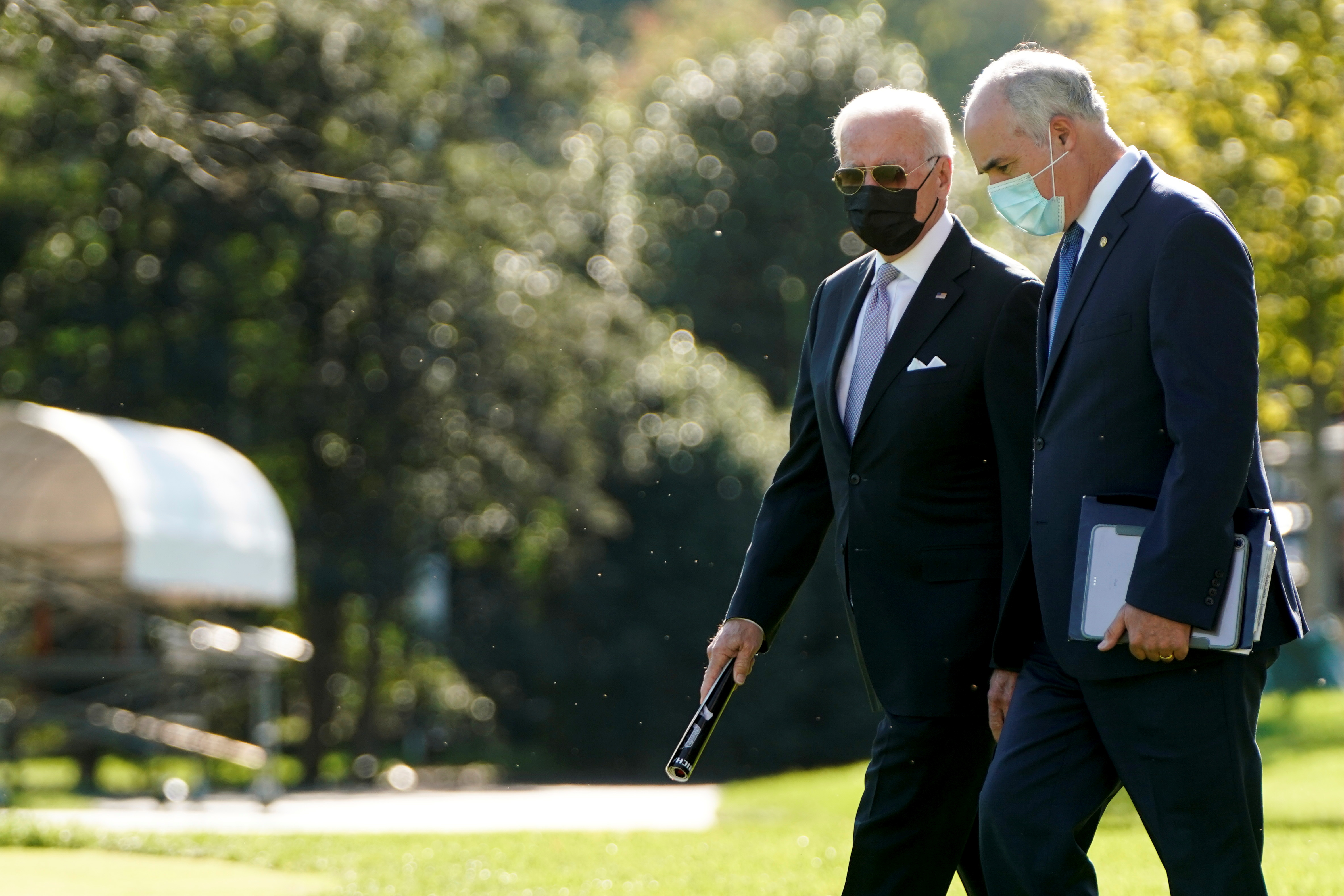 U.S. President Joe Biden walks with Senator Robert Casey (D-PA) to Marine One as they depart for Scranton, Pennsylvania, from the White House in Washington, U.S., October 20, 2021.      REUTERS/Joshua Roberts