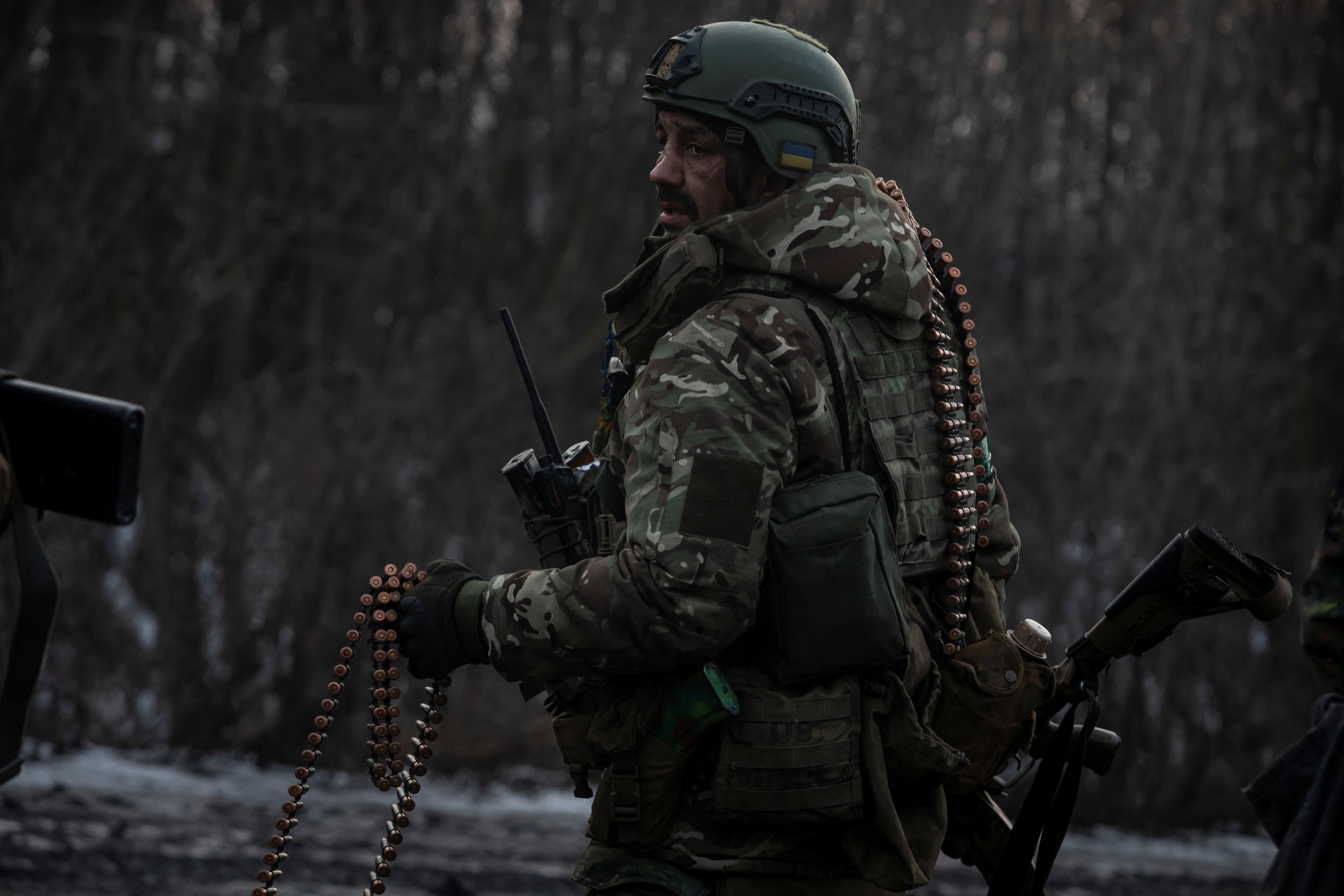 Ukrainian serviceman is seen on a road outside the frontline town of Bakhmut