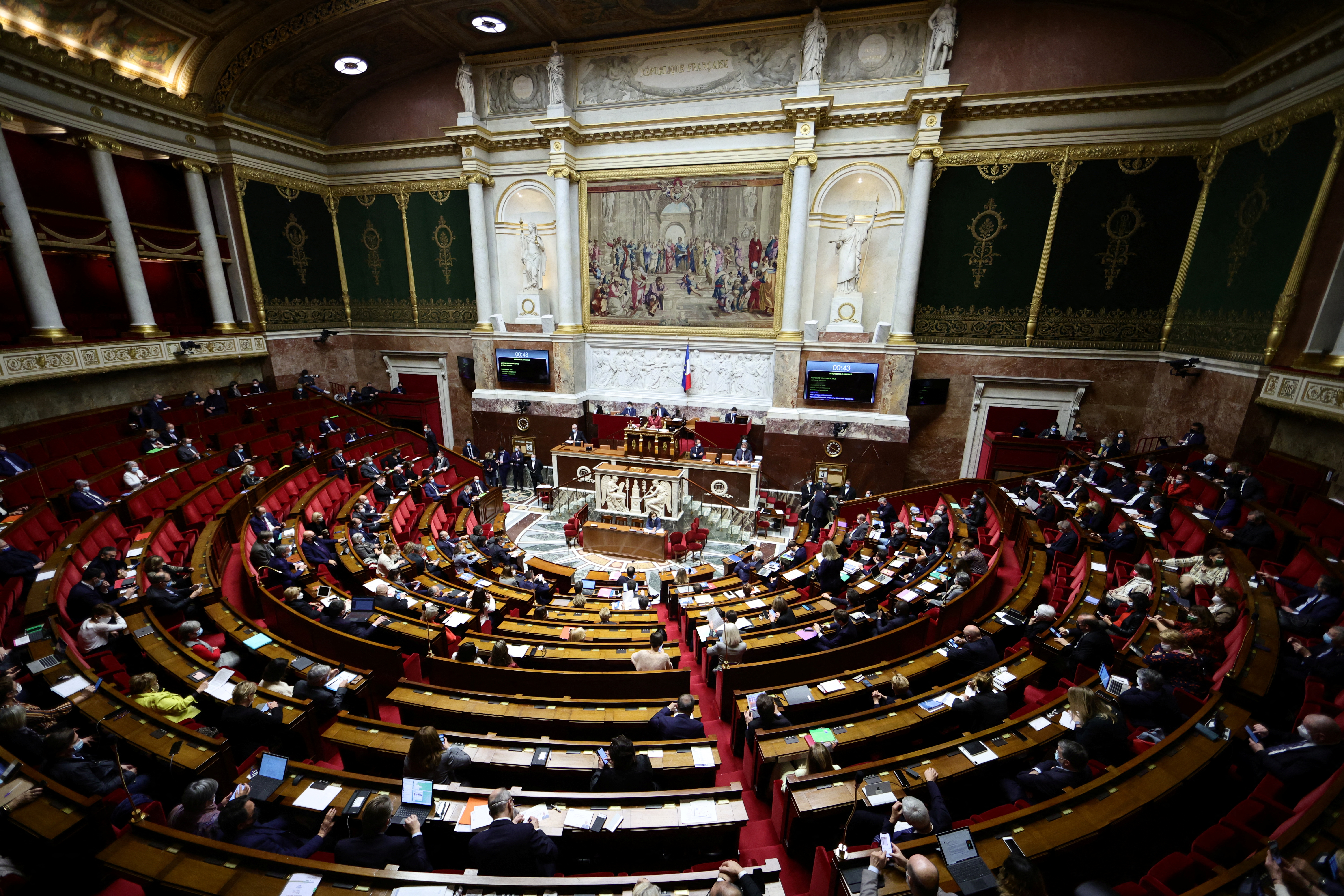 French lawmakers discuss government's vaccine pass bill at the National Assembly in Paris