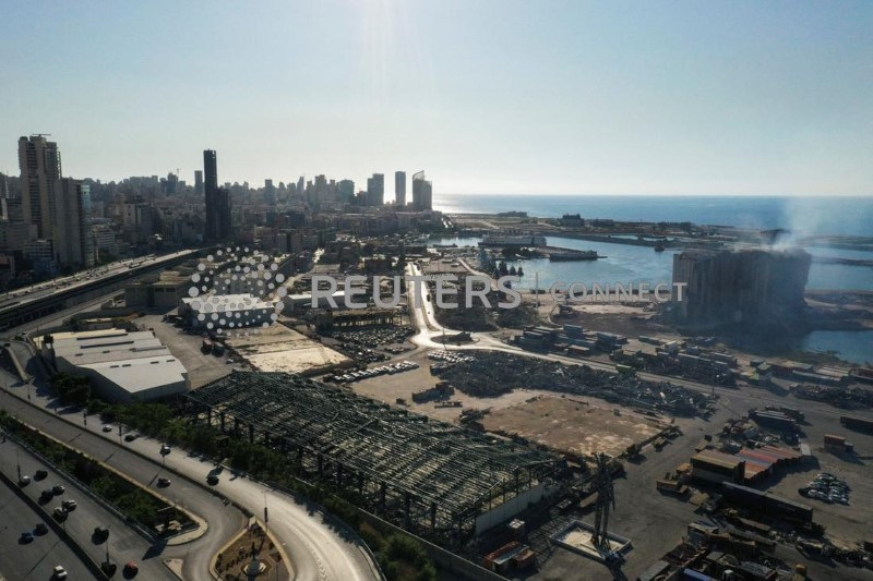 Smoke rises from the Beirut grain silos damaged in the August 2020 port blast, in Beirut