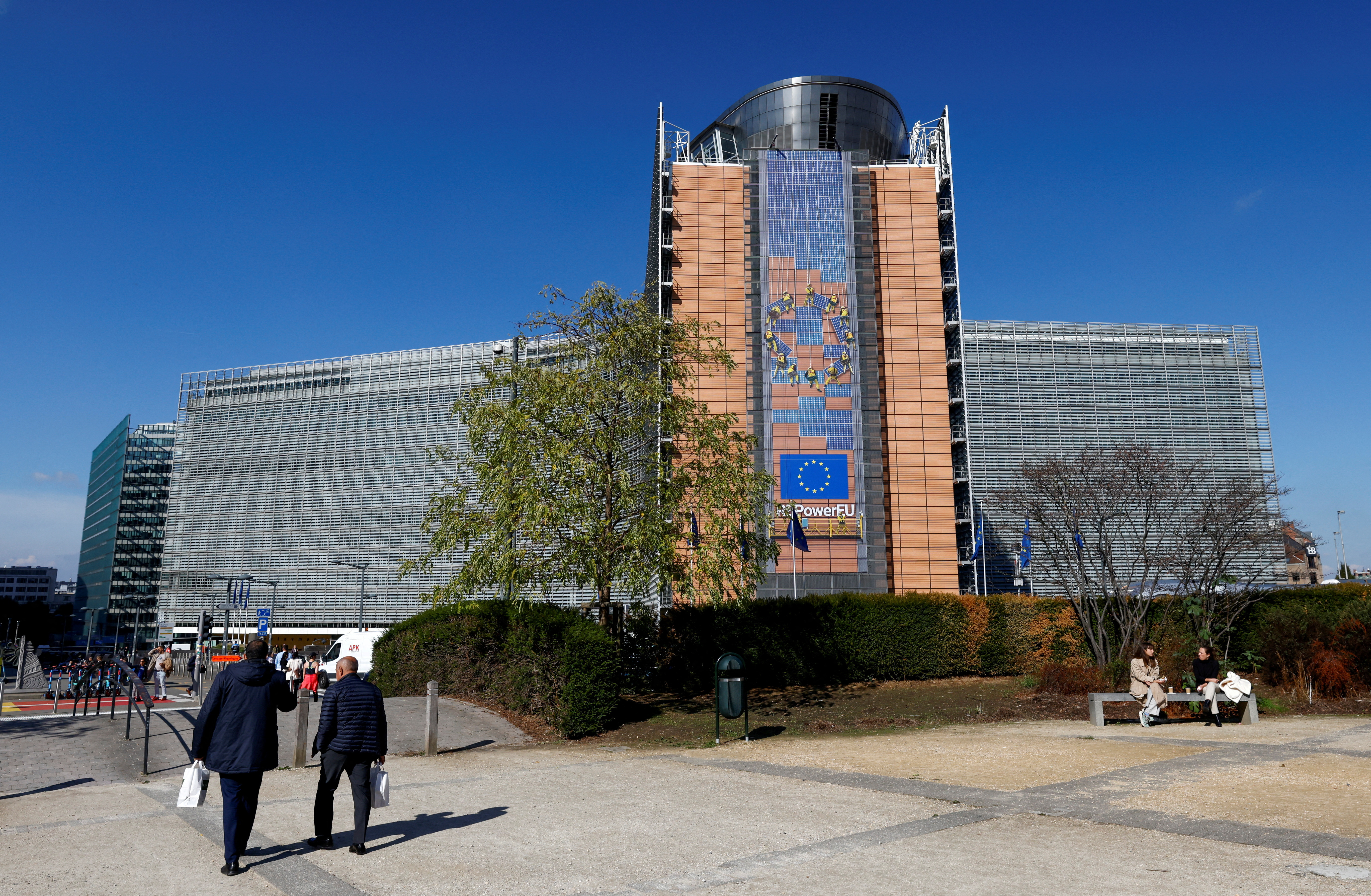 Belgian police stand outside the Berlaymont building, headquarters of the European Commission, where an envelope with suspect white powder was found in Brussels