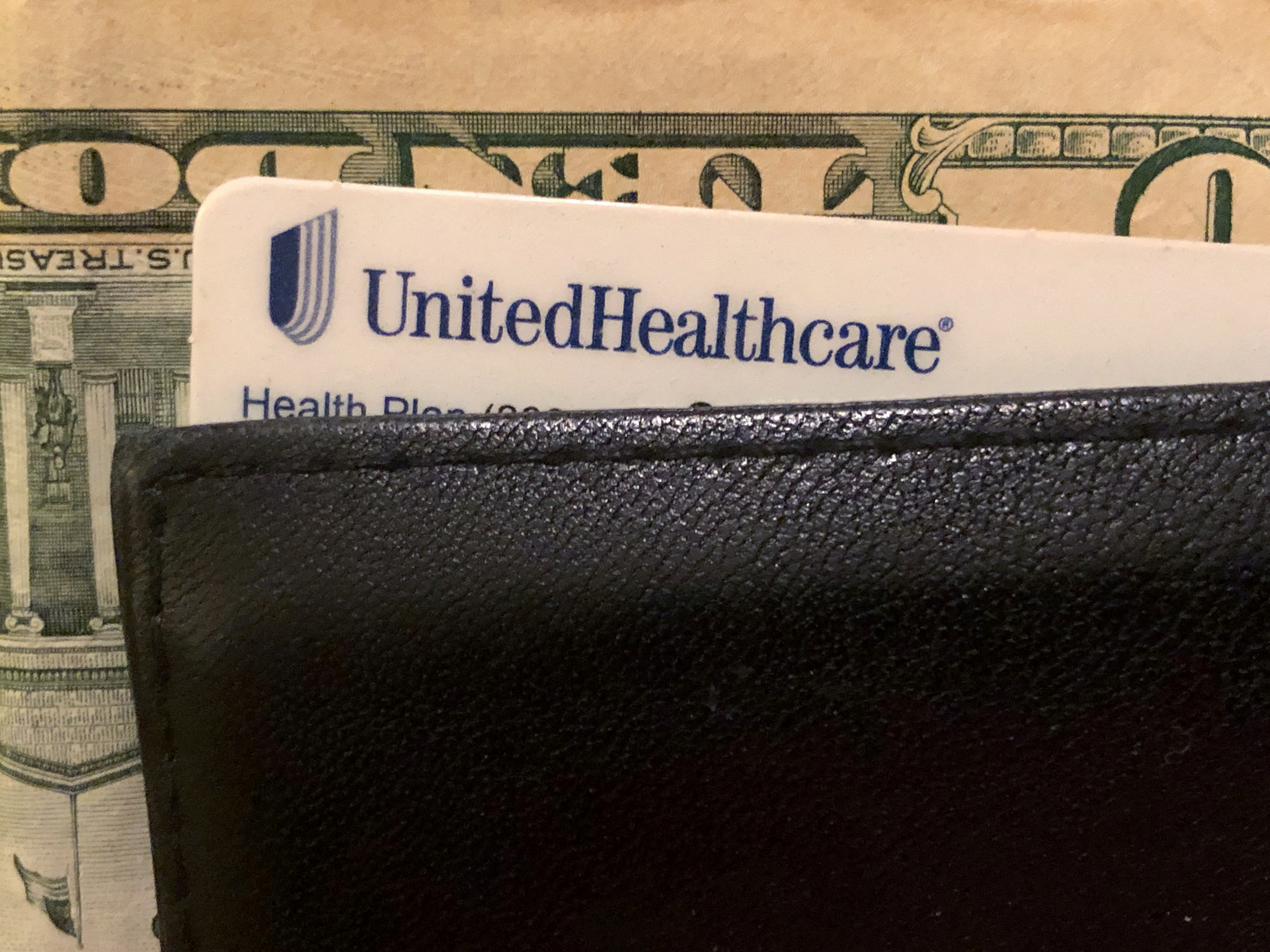 Picture illustration of a UnitedHealth Group health insurance card in a wallet