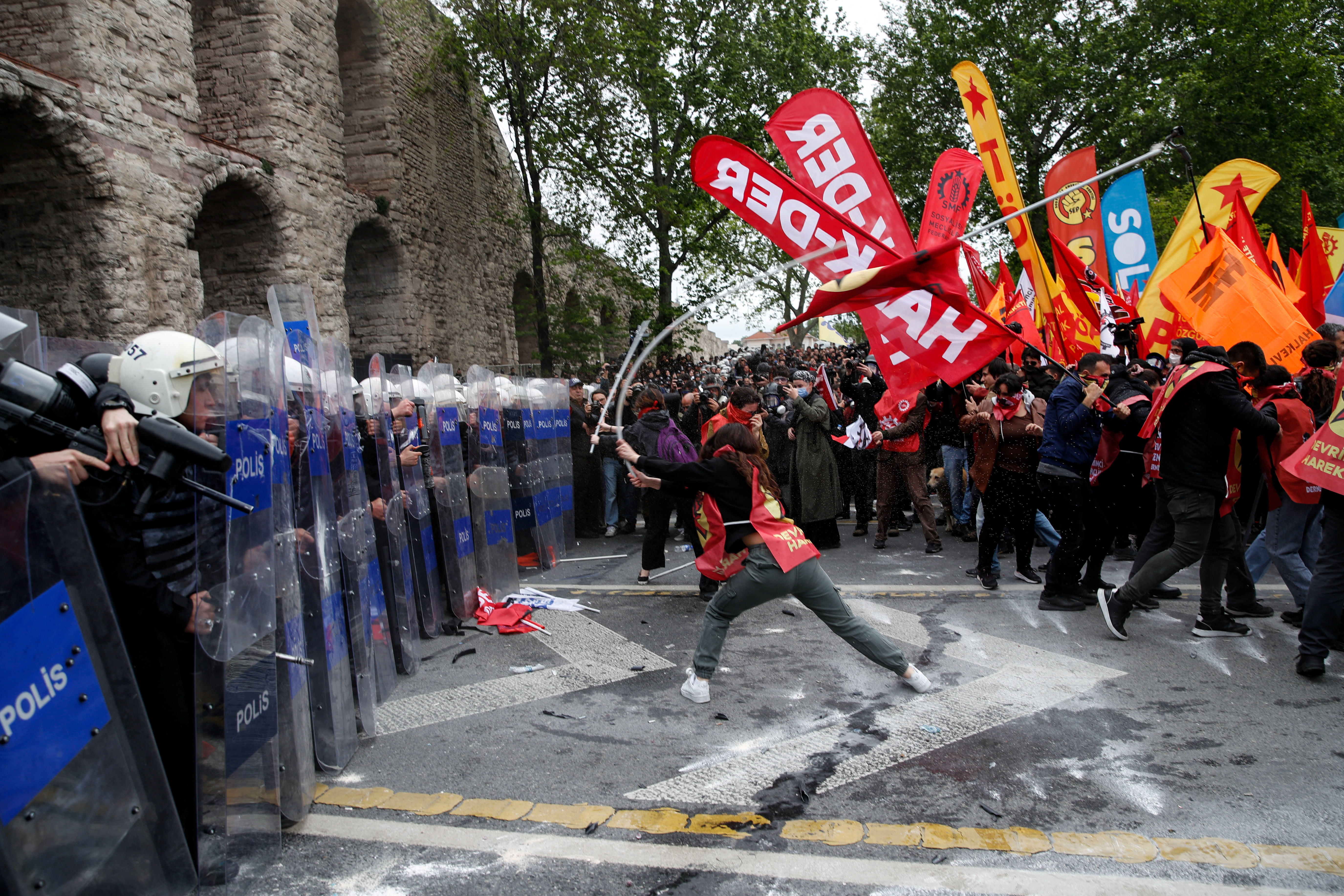 Protesters scuffle with riot police as they attempt to defy a ban and march on Taksim Square to celebrate May Day in Istanbul