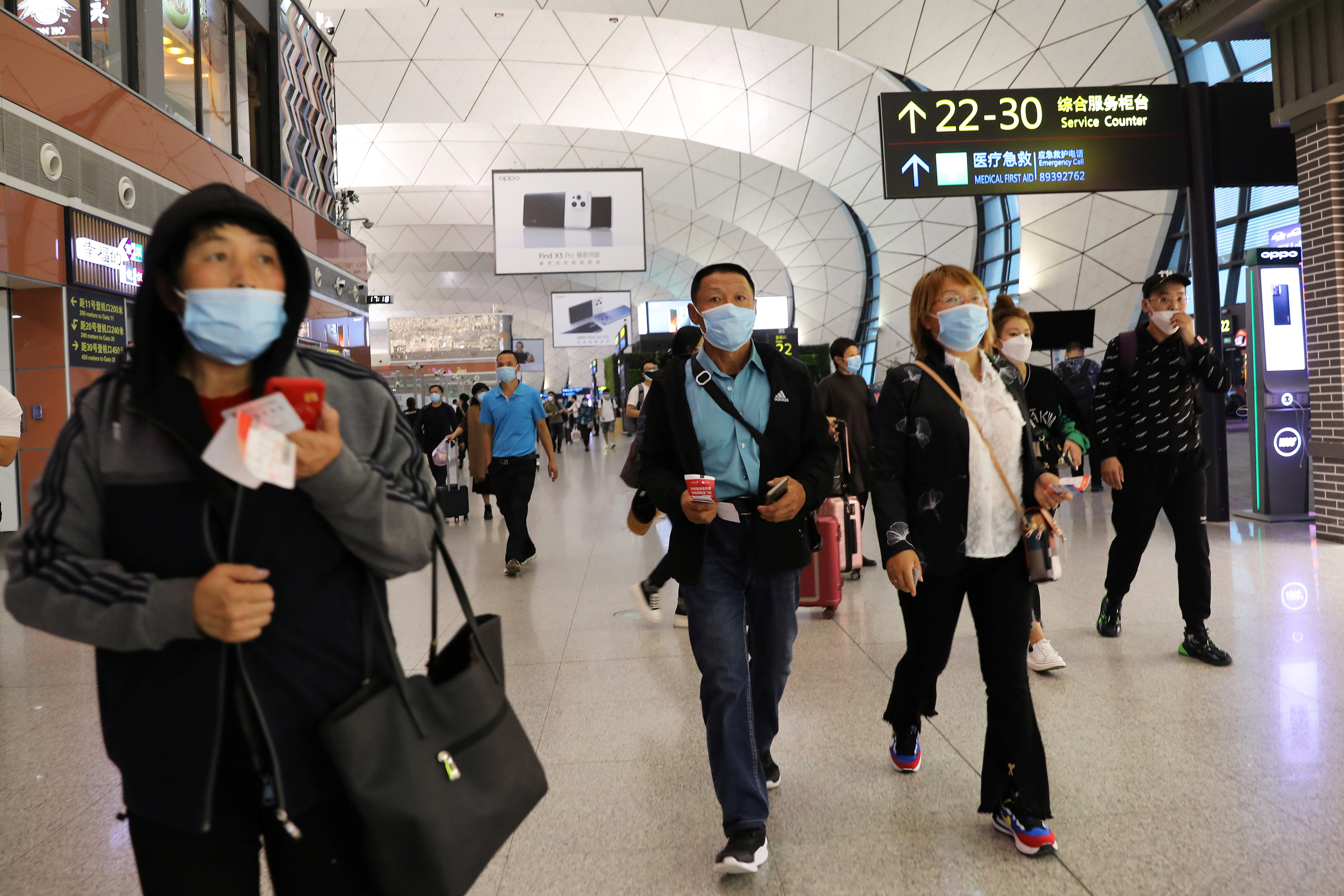 Travellers at Taoxian International Airport ahead of China's National Day and Golden Week holiday, in Shenyang