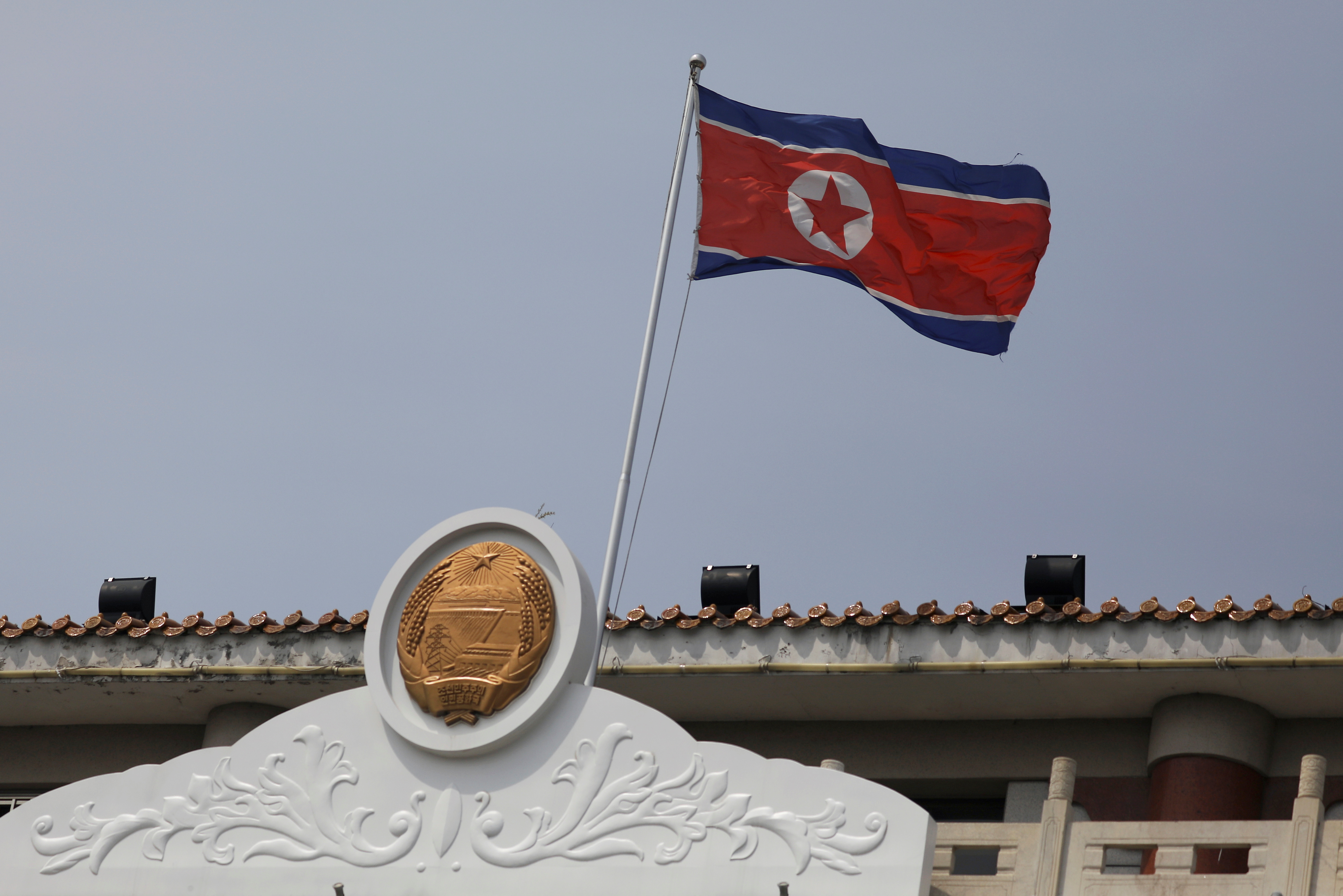 The North Korean flag flutters at the North Korea consular office in Dandong