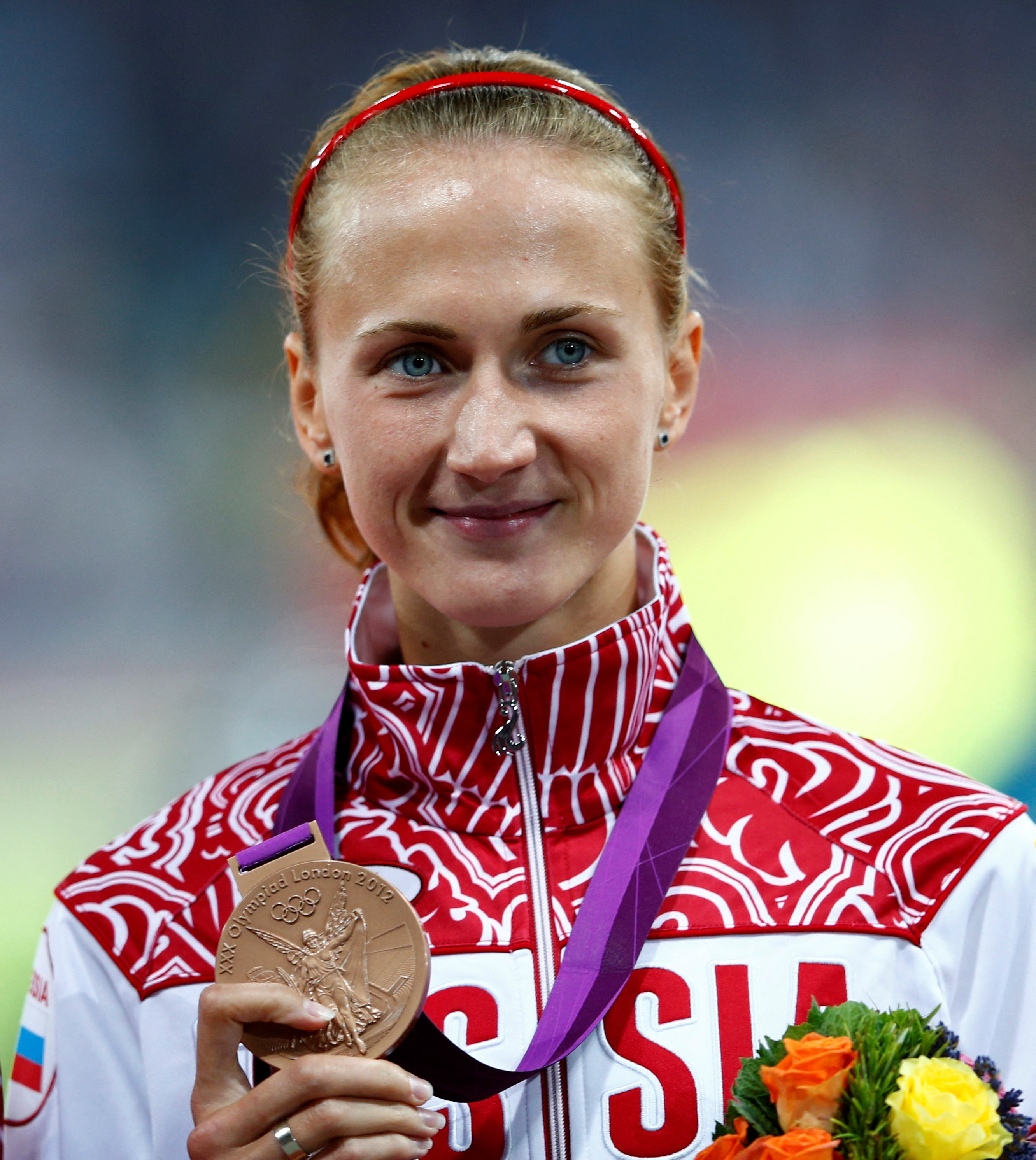 Russia's Ekaterina Poistogova holds her bronze medal during the women's 800m victory ceremony at the London 2012 Olympic Games