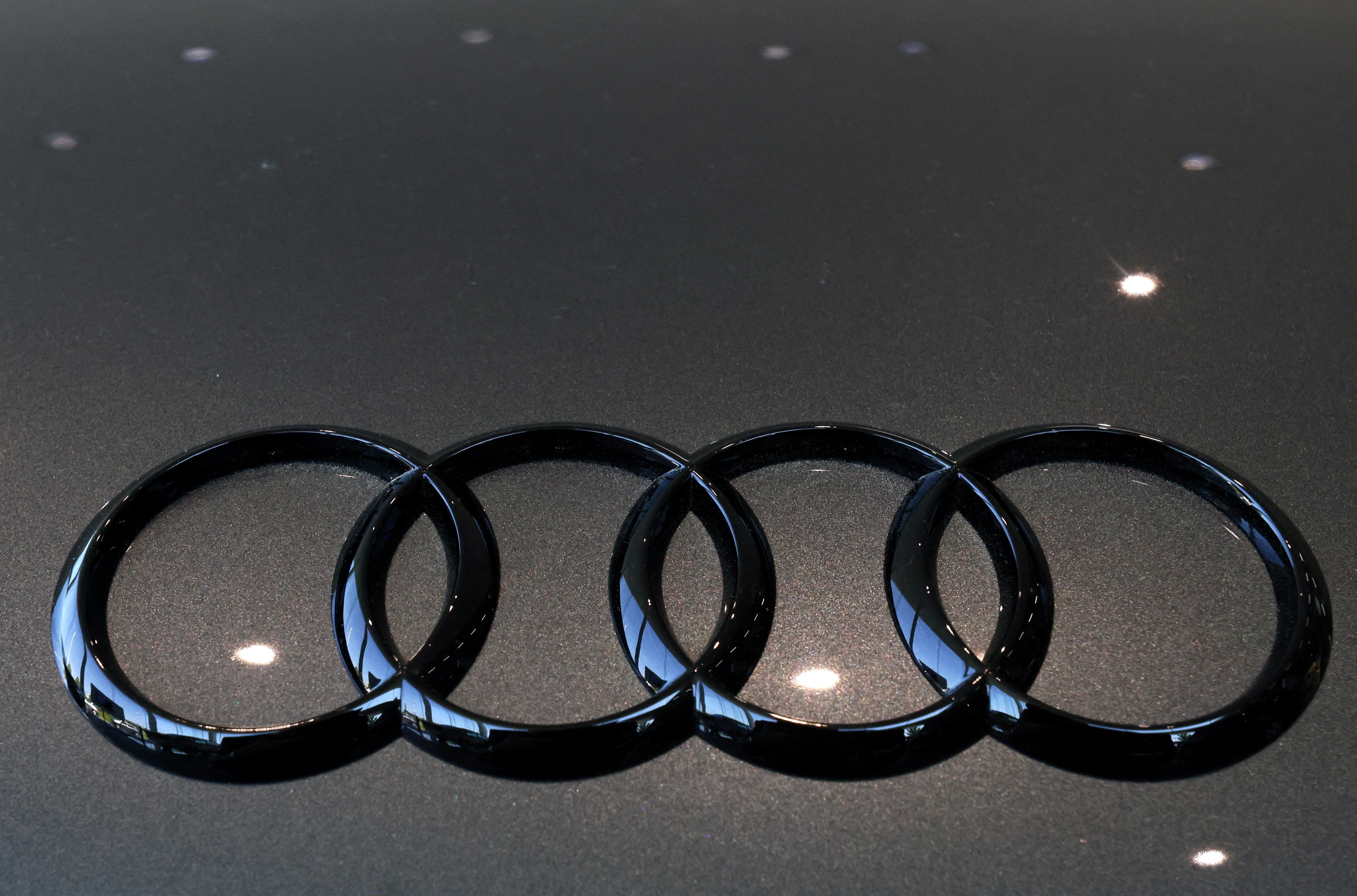 The logo of Audi is seen on a car in Brussels