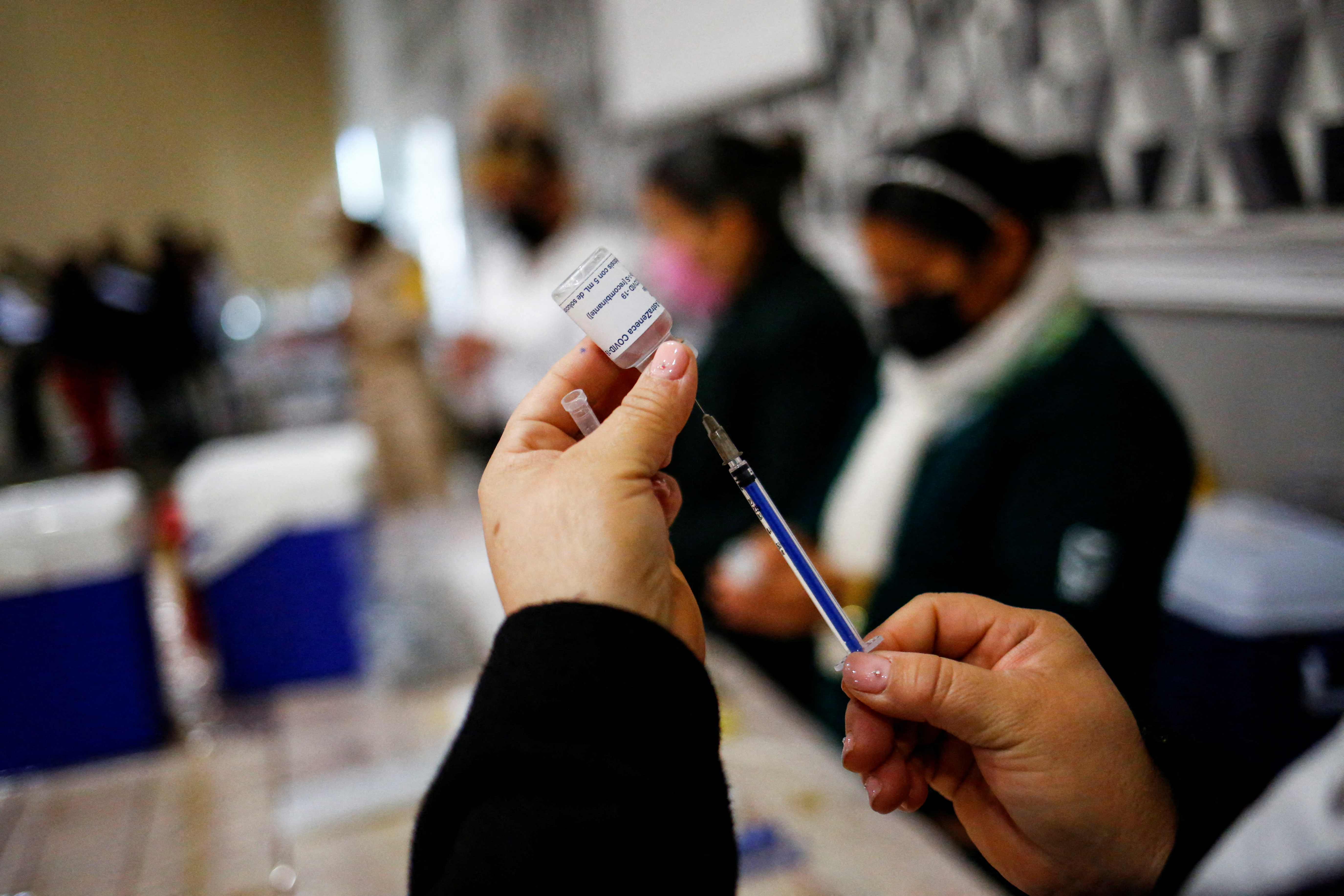 Health workers receive a booster shot of the AstraZeneca coronavirus disease (COVID-19) vaccine, in Ciudad Juarez