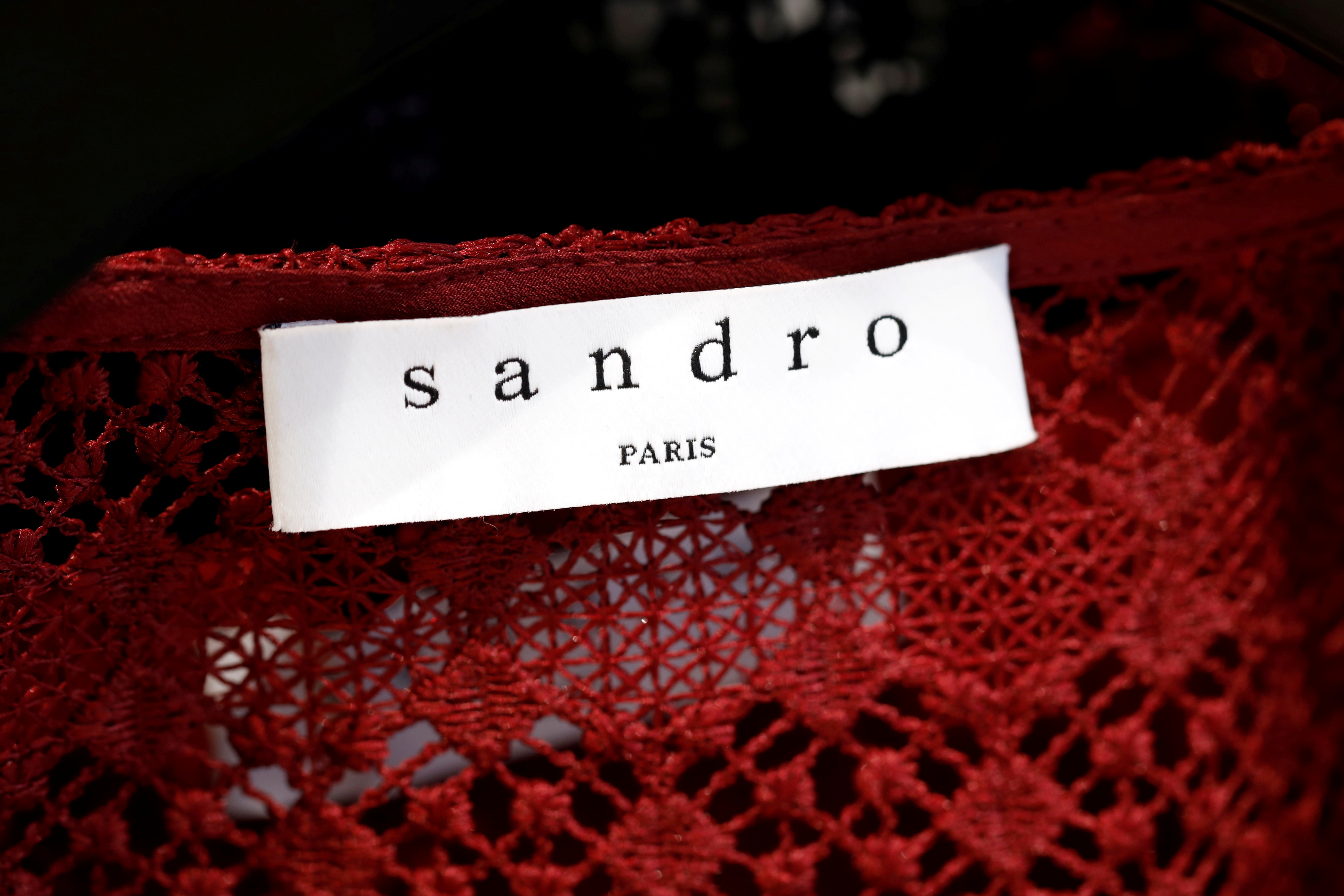 A Sandro label is pictured on clothes inside a Sandro luxury clothing store, operated by SMCP Group, in Paris, France, December 21, 2017. REUTERS/Benoit Tessier