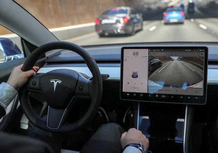 The interior of a Tesla Model 3 electric vehicle is shown in Moscow