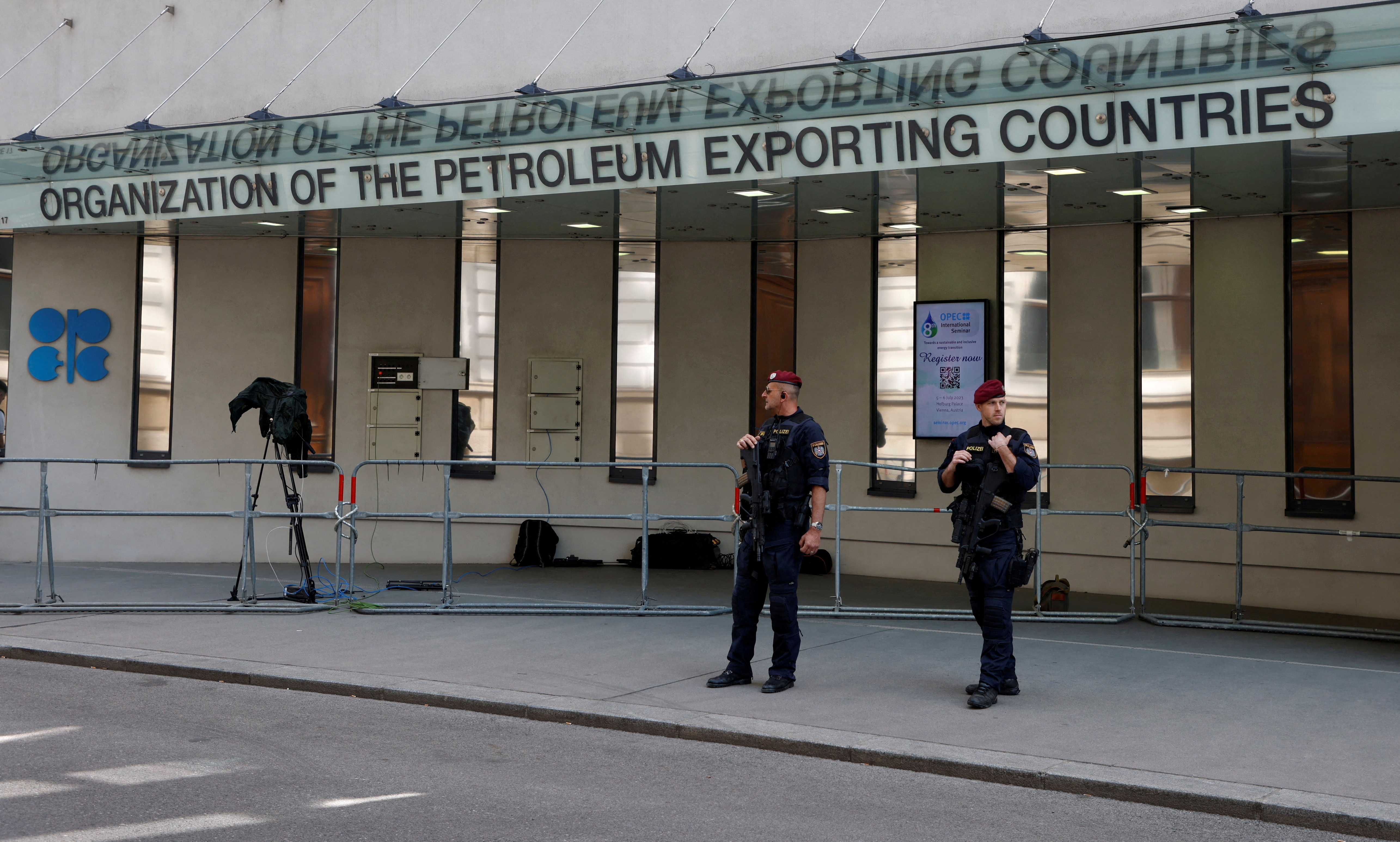 Austrian police officers stand in front of the OPEC headquarters in Vienna