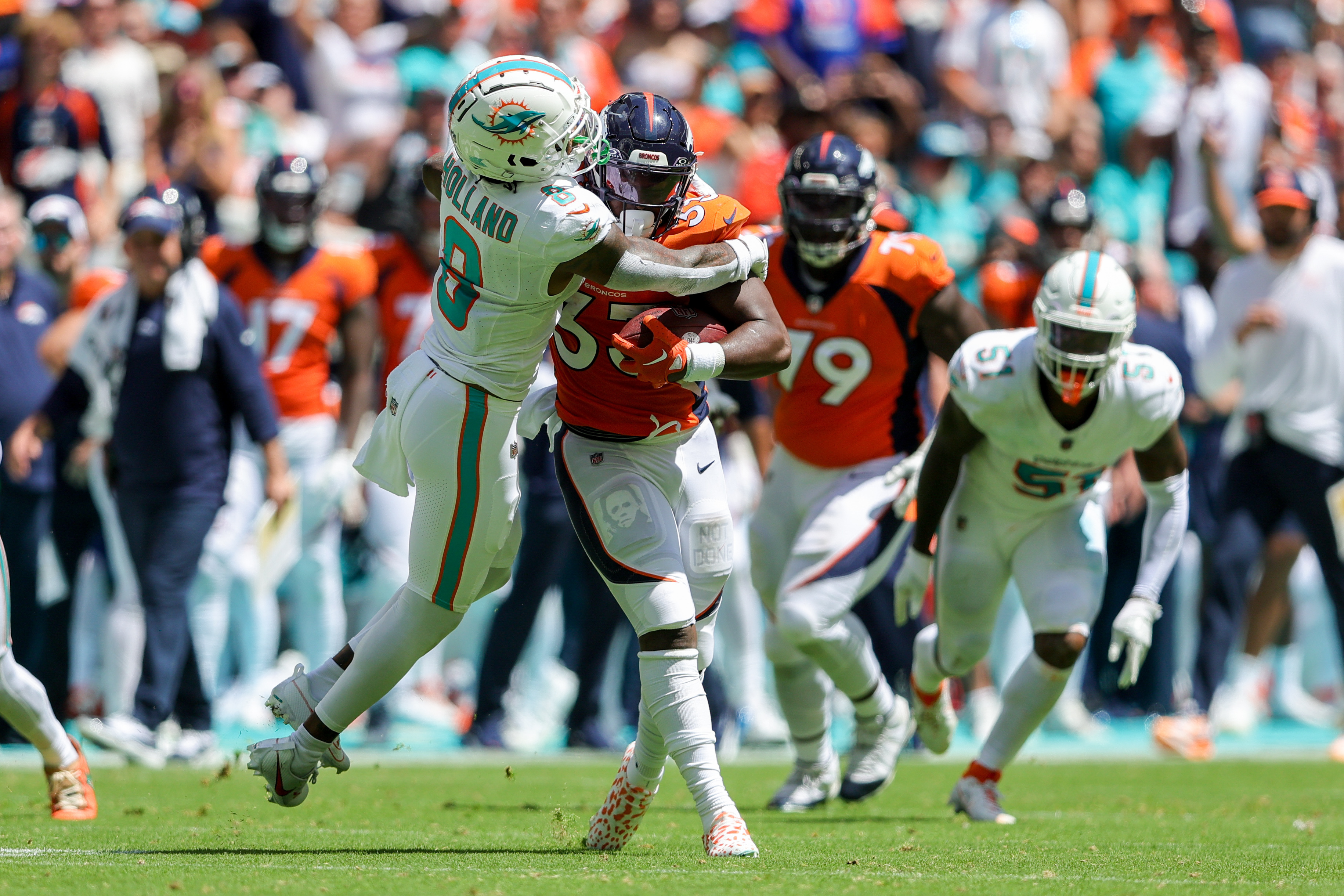 Dolphins pour it on with 70-20 rout over Broncos