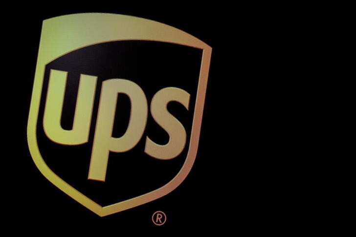 FILE PHOTO: The company logo for United Parcel Service (UPS), is displayed  on a screen at the NYSE in New York