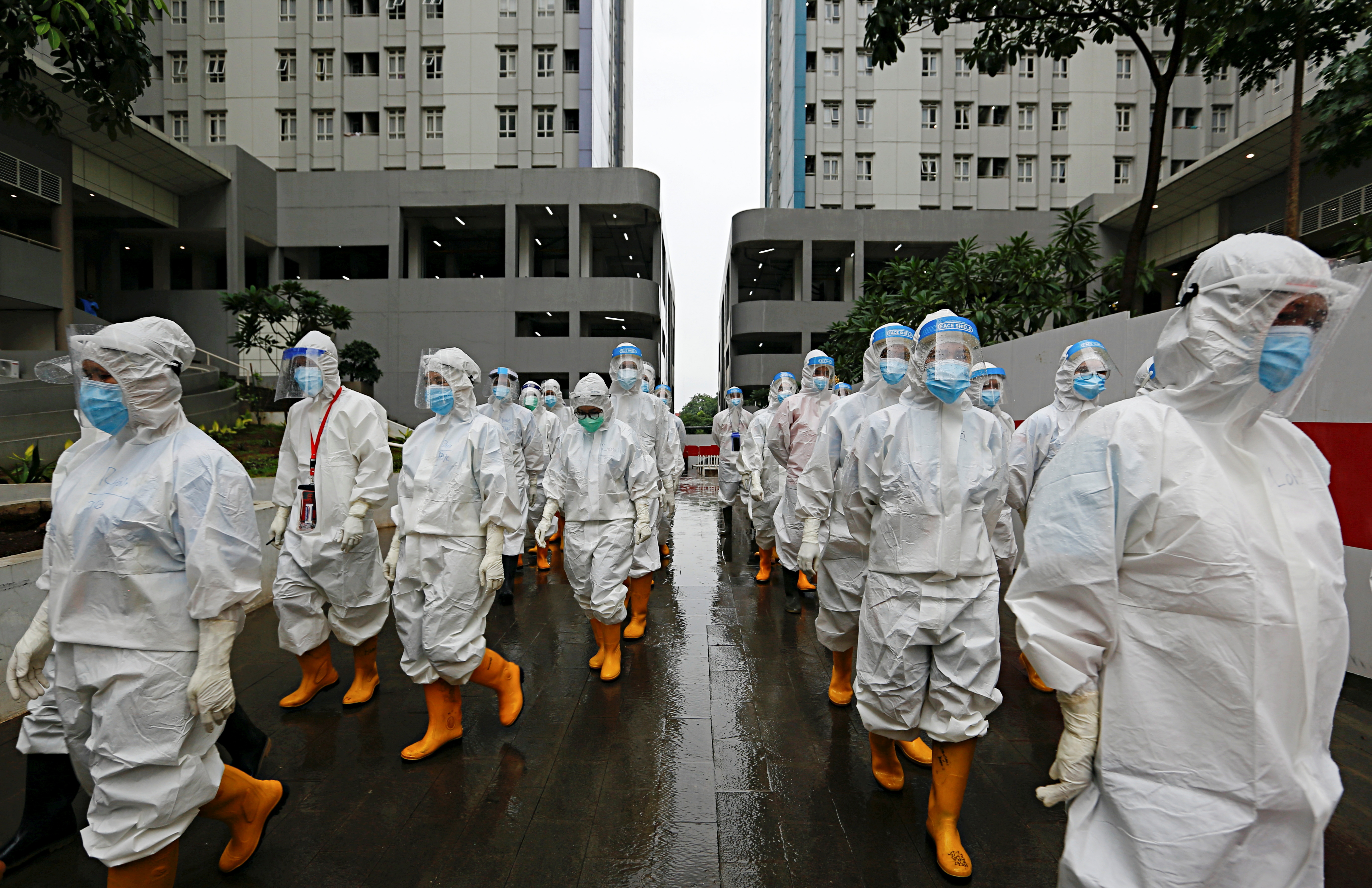 Healthcare workers prepare to treat patients at the emergency hospital for coronavirus disease (COVID-19) in Athletes Village, Jakarta, Indonesia January 26, 2021. REUTERS/Ajeng Dinar Ulfiana
