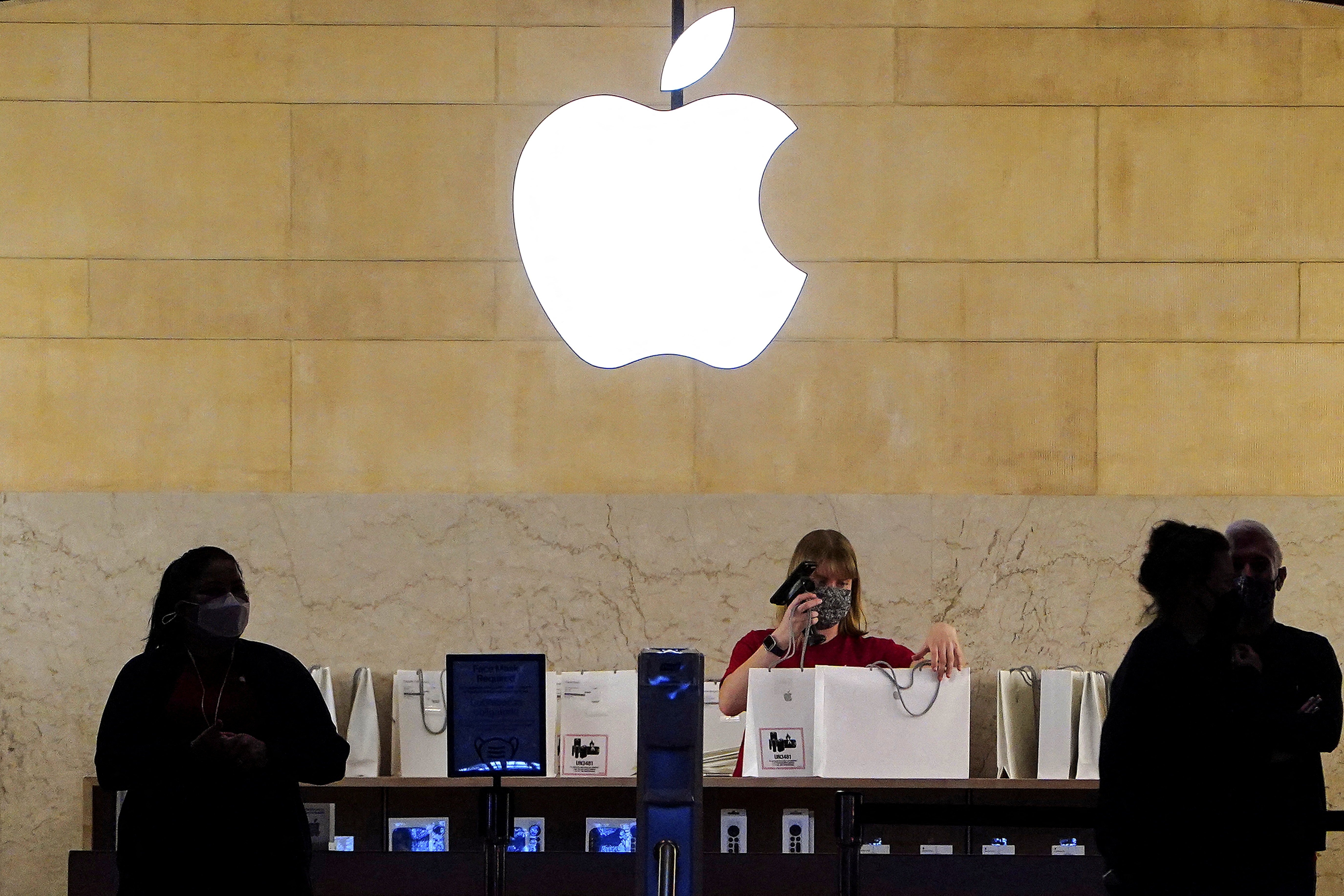 Apple employees work in Apple Store at Grand Central Terminal, New York City