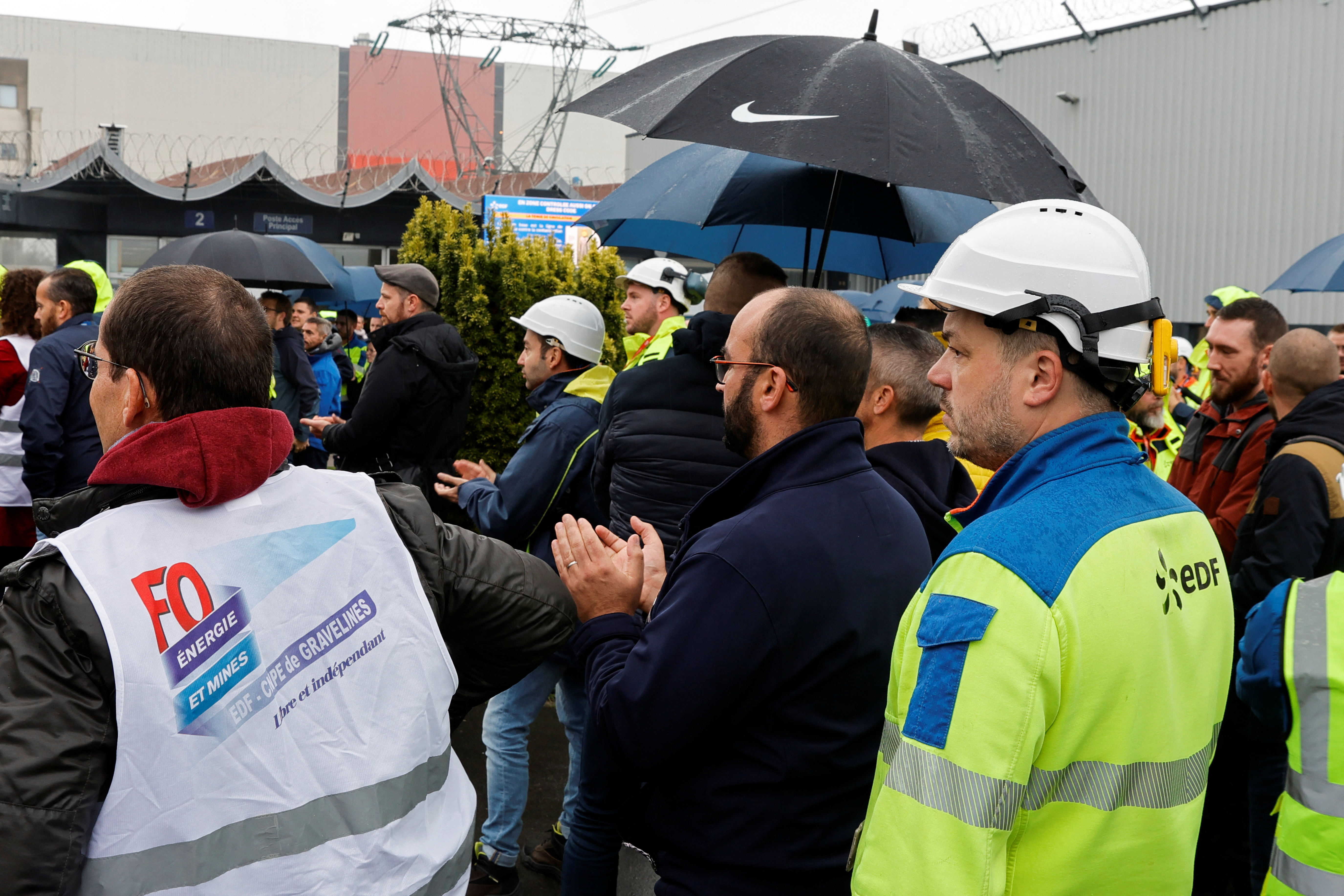 Workers listen to trade unionists during a general assembly at EDF nuclear power plant in Gravelines