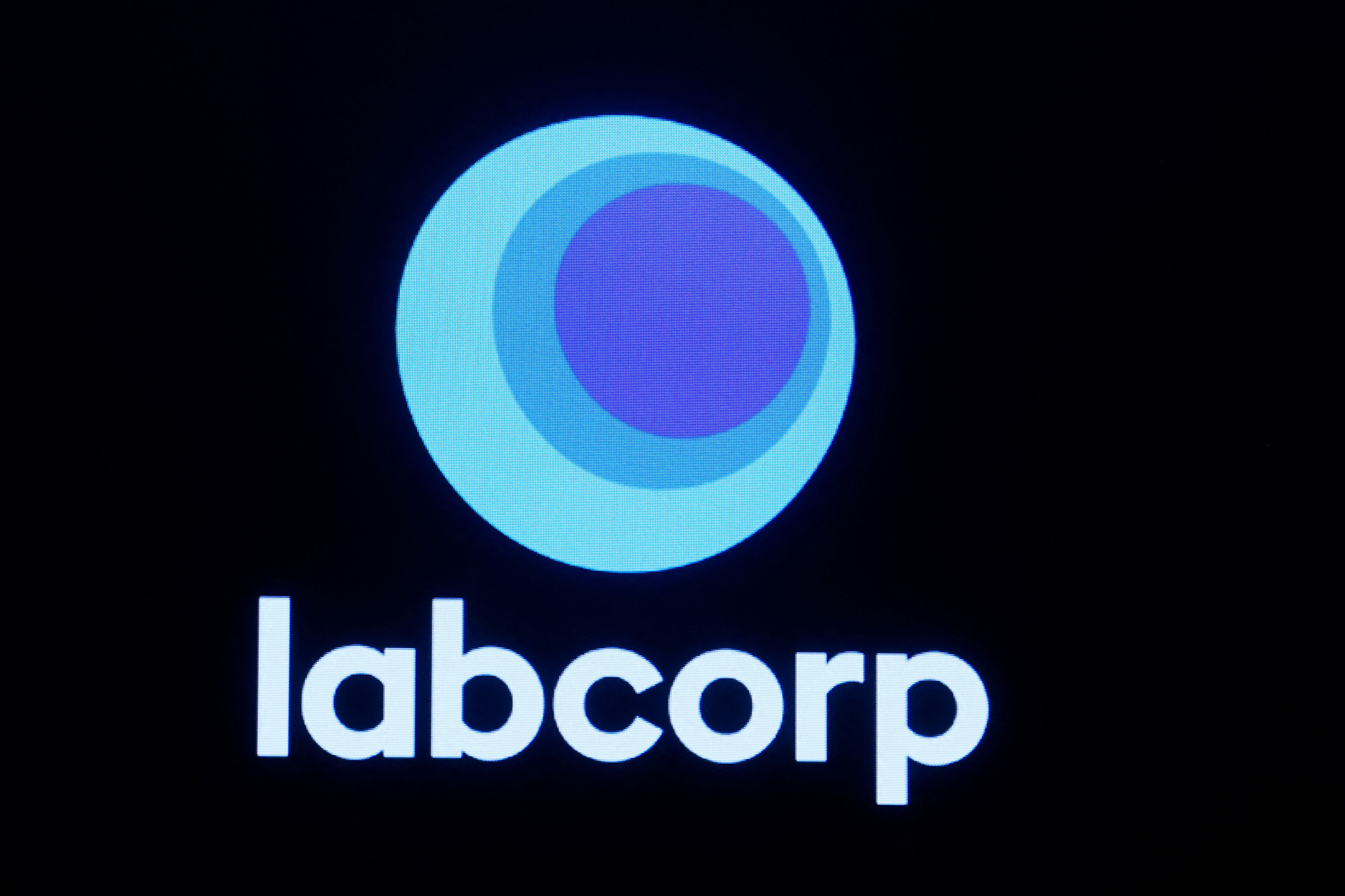 The logo for Labcorp is displayed on a screen on the floor of the NYSE in New York