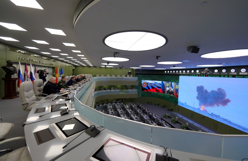 Russia's President Vladimir Putin (5th L) visits the National Defence Control Centre (NDCC) to oversee the test of a new Russian hypersonic missile system called Avangard, which can carry nuclear and conventional warheads, in Moscow, Russia December 26, 2018. Sputnik/Mikhail Klimentyev/Kremlin via REUTERS