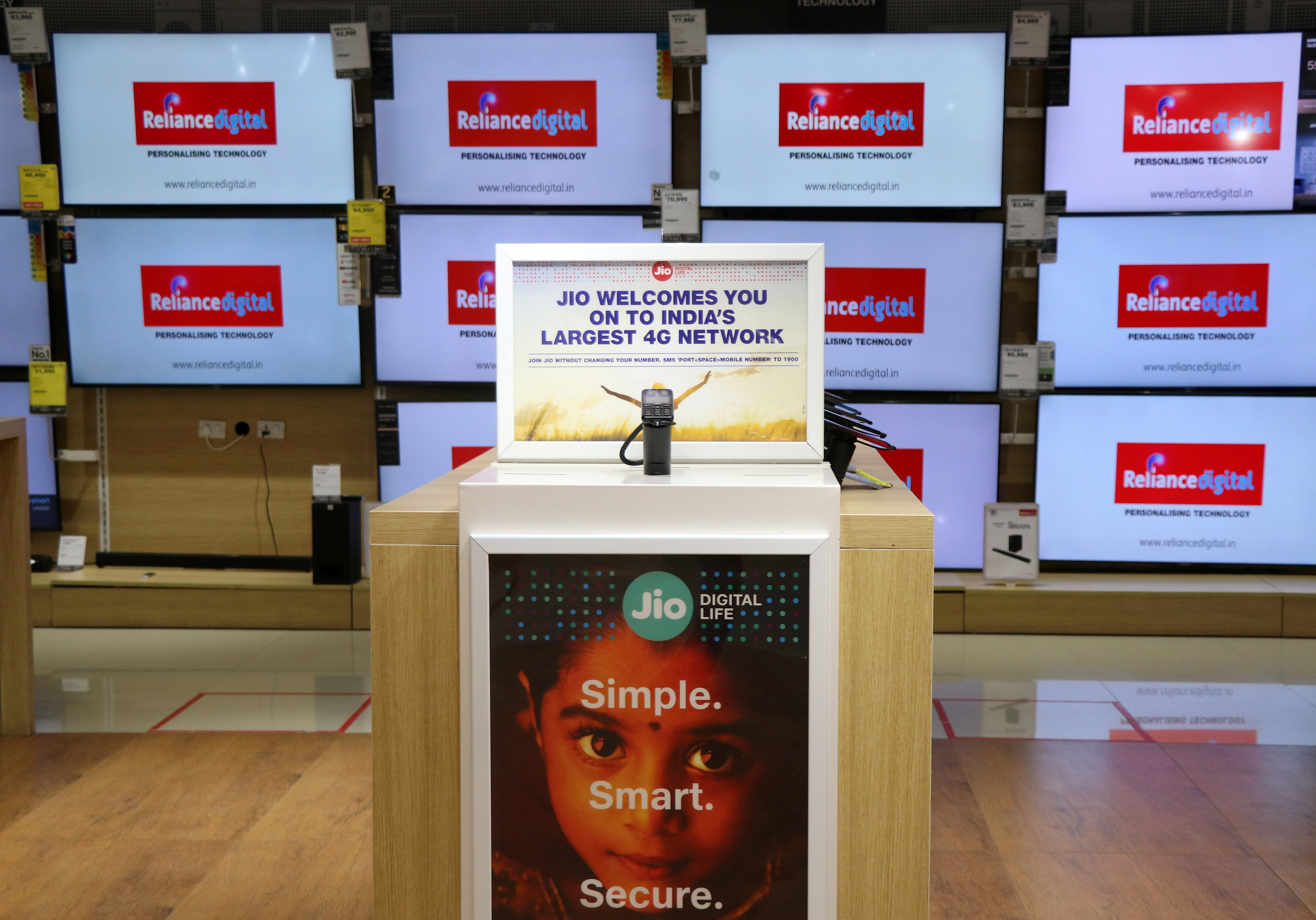A Jio mobile phone is on display inside a digital store of Reliance Industries Ltd, Mumbai